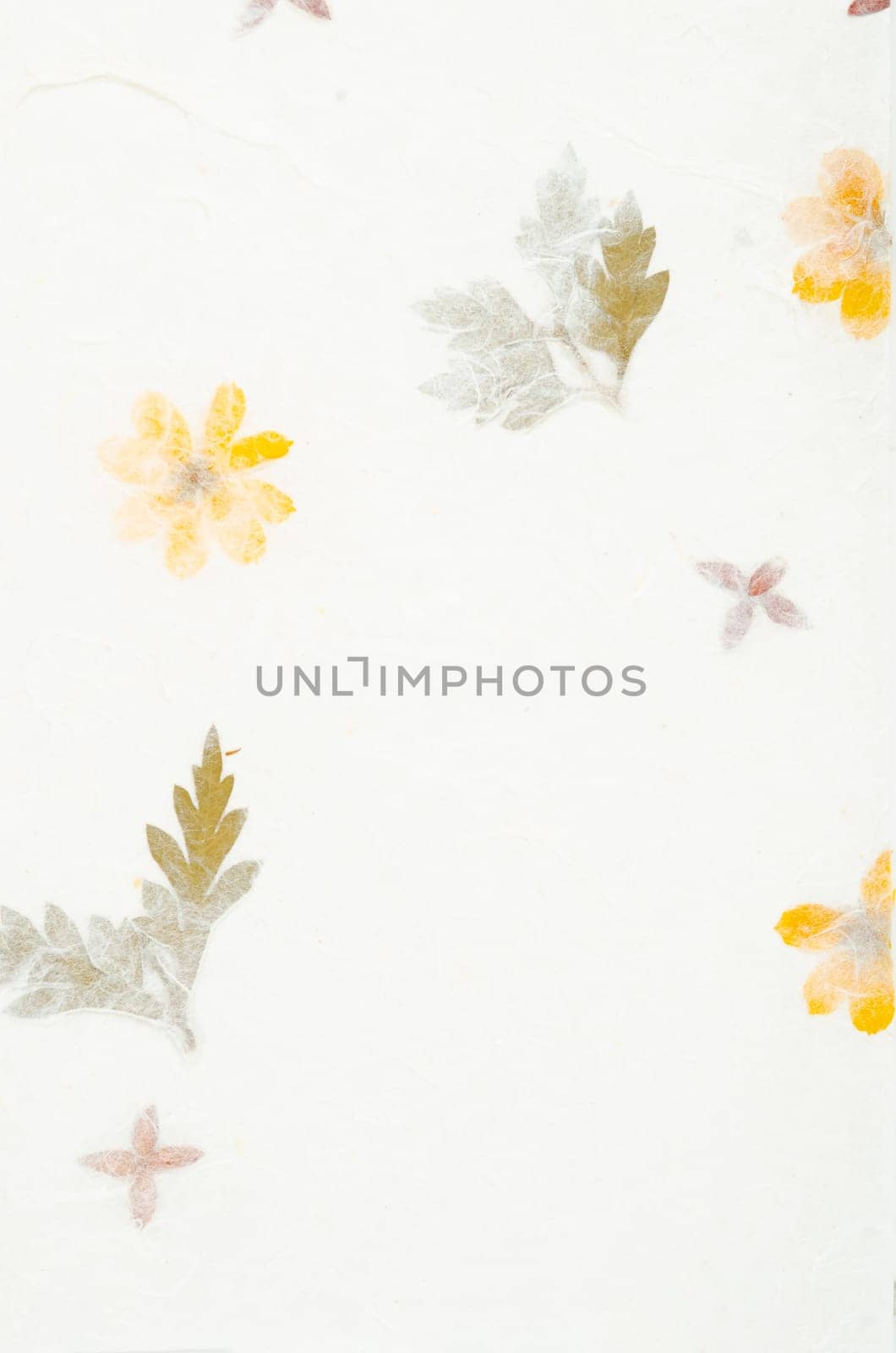 The Handmade recycled leaf paper background. by Gamjai