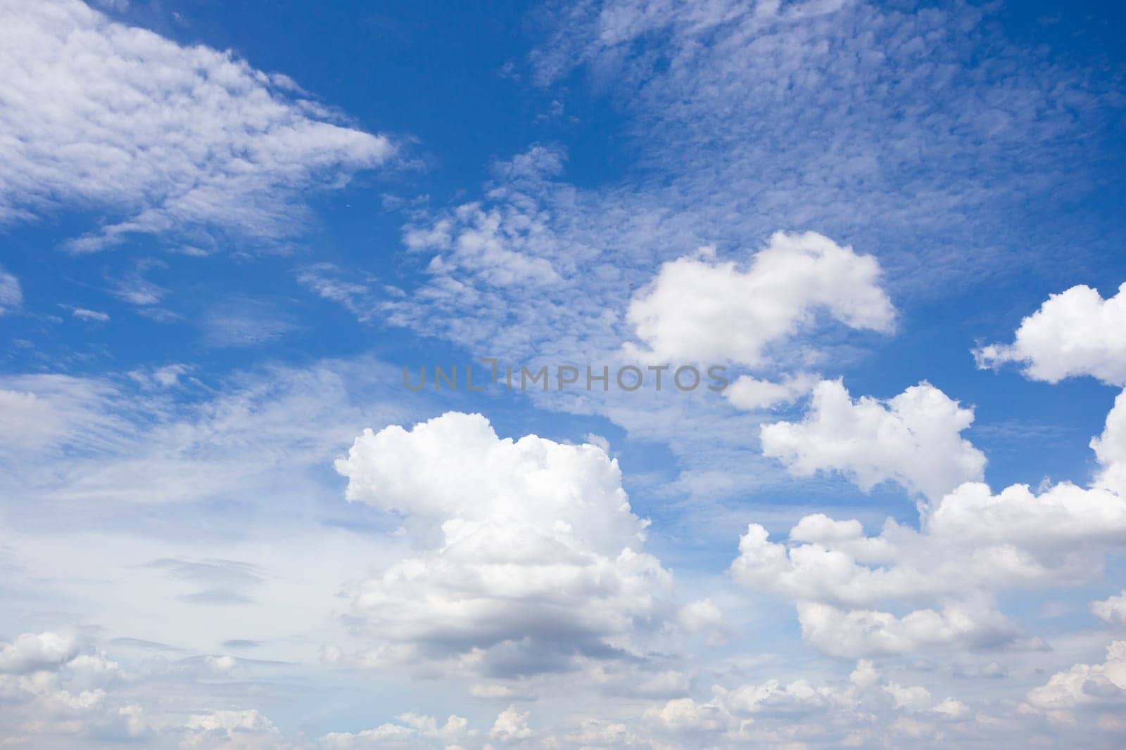 The white cloud and bright blue sky for background by Gamjai