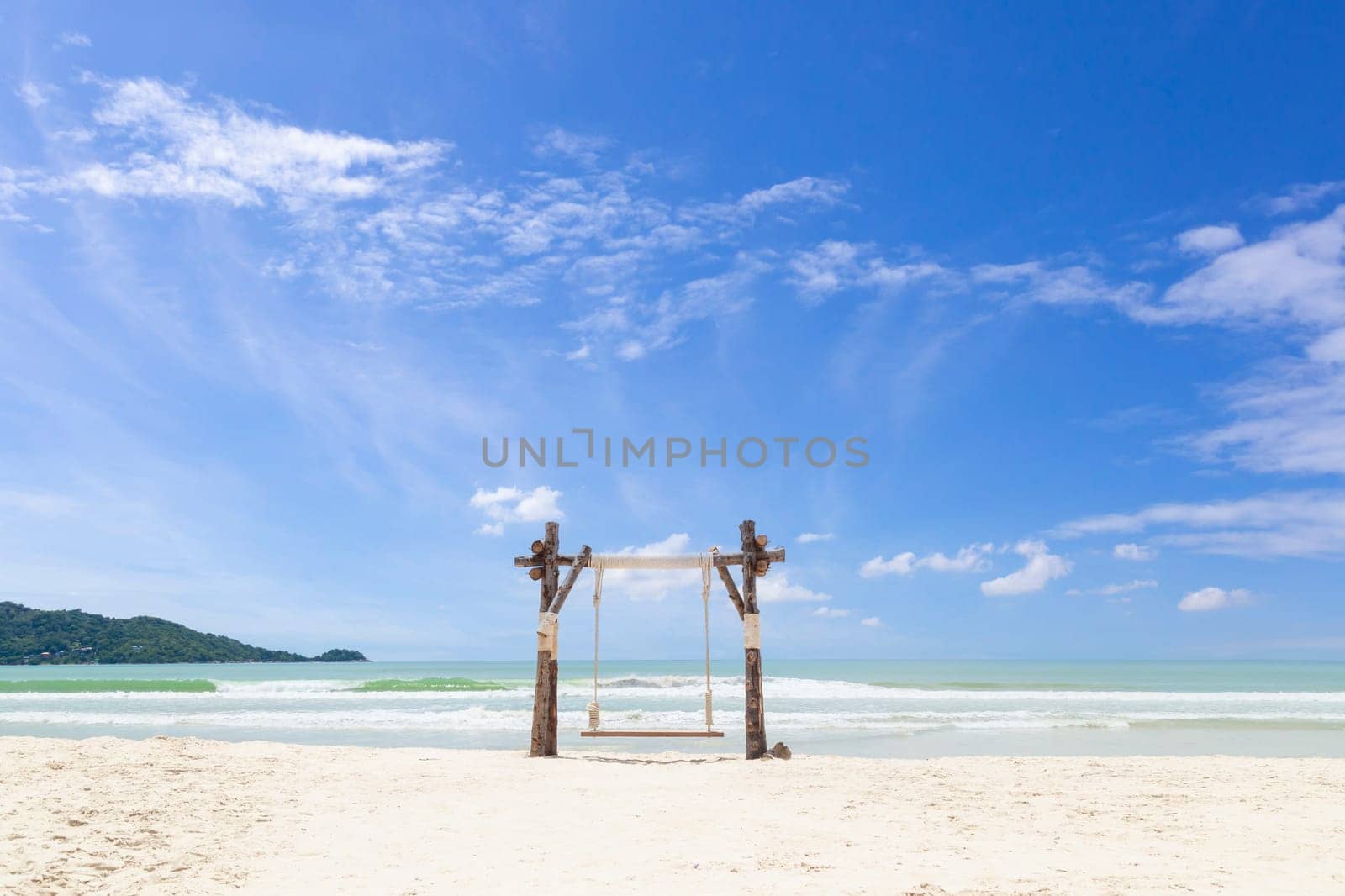 The Exotic Tropical Paradise Swings over Crystal Clear Turquoise Blue Ocean Sea Water Landscape Seascape by Gamjai