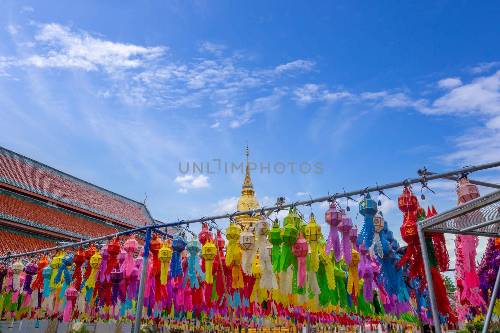 The Wat Phra That Hariphunchai pagoda with light Festival at Lamphun, Thailand. by Gamjai