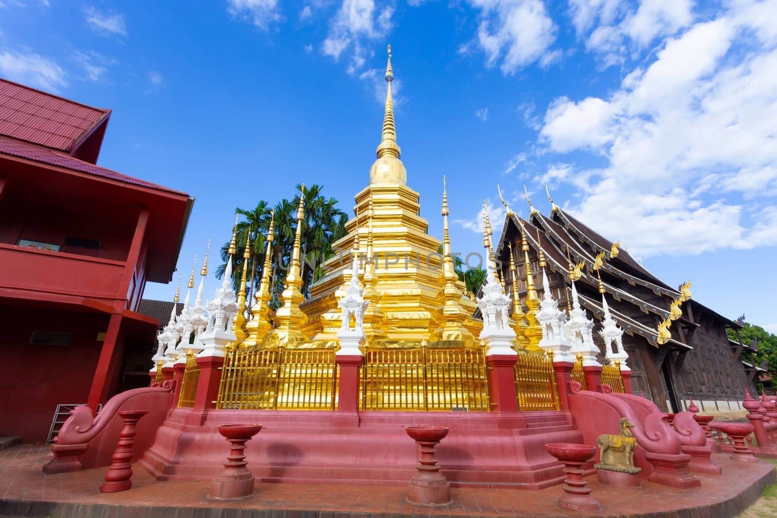 The golden pagoda of Wat Pan Tao in Chiang Mai city, Thailand by Gamjai