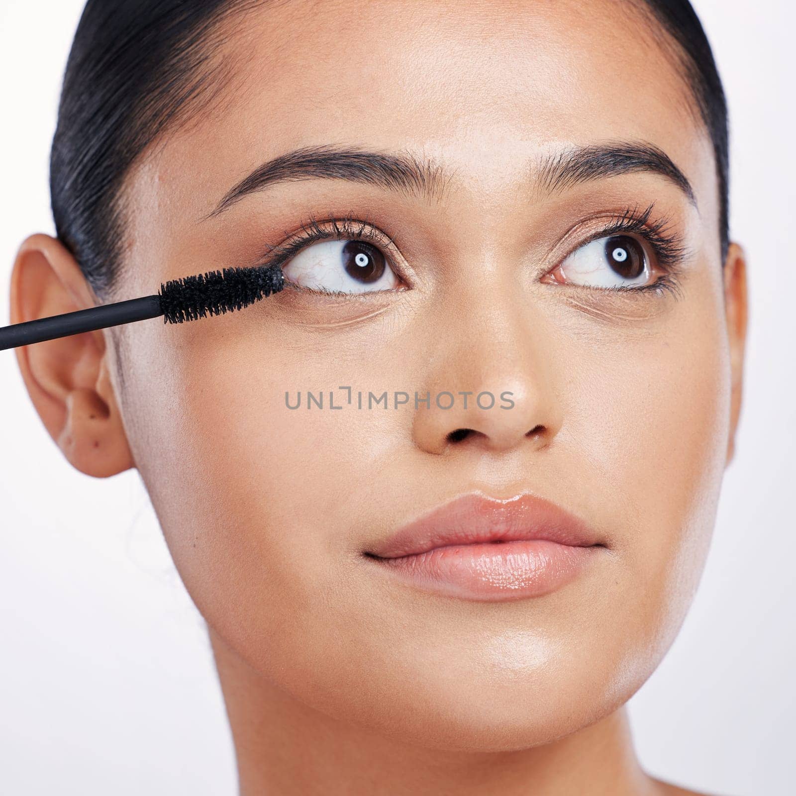 Mascara, brush and eye makeup, beauty with woman and face, eyelash extension isolated on studio background. Female model closeup, natural cosmetics and skin glow with cosmetic product and cosmetology.
