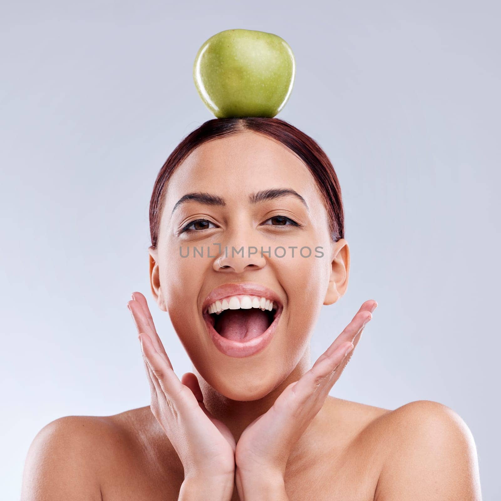 Apple, balance or portrait of excited woman in studio on white background for healthy nutrition or clean diet. Smile, wow or happy girl advertising or marketing a natural green fruit for wellness.