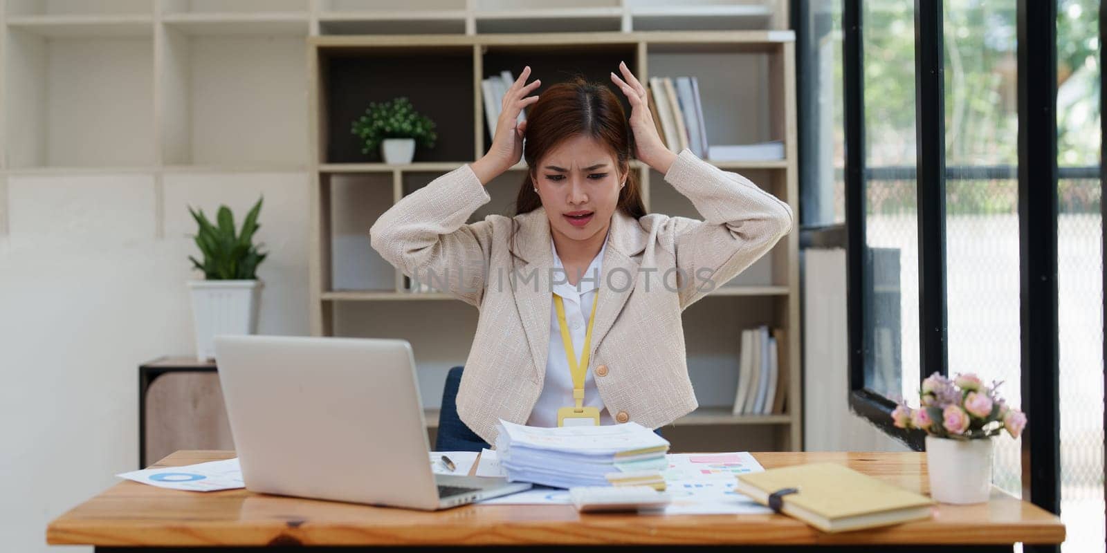 Deadline with young business woman feeling stressed concept. Business woman working at office, business finance concept.