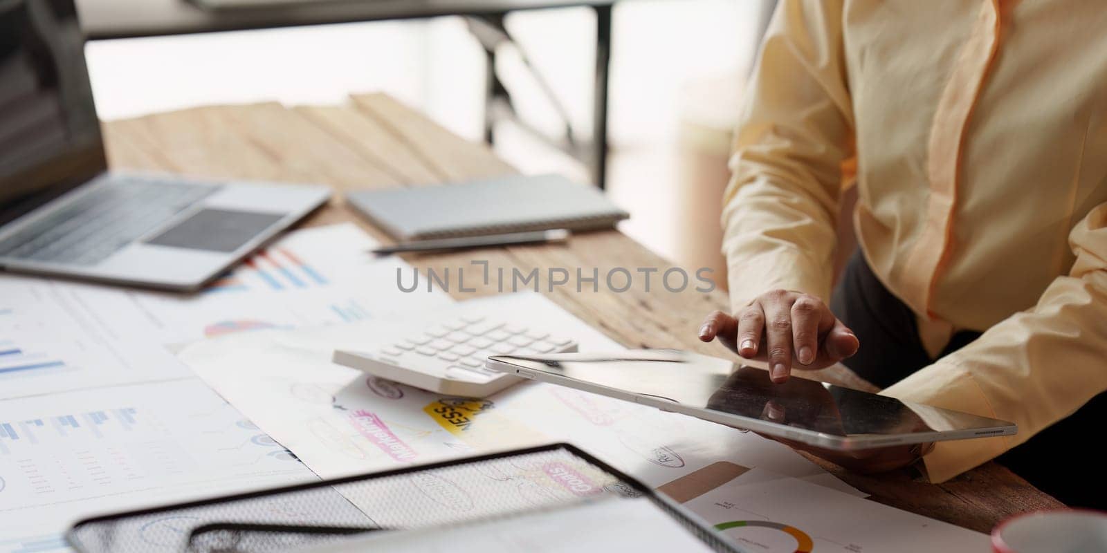 Accountant asian woman working on tablet and do document, tax, exchange, accounting and Financial advisor concept.