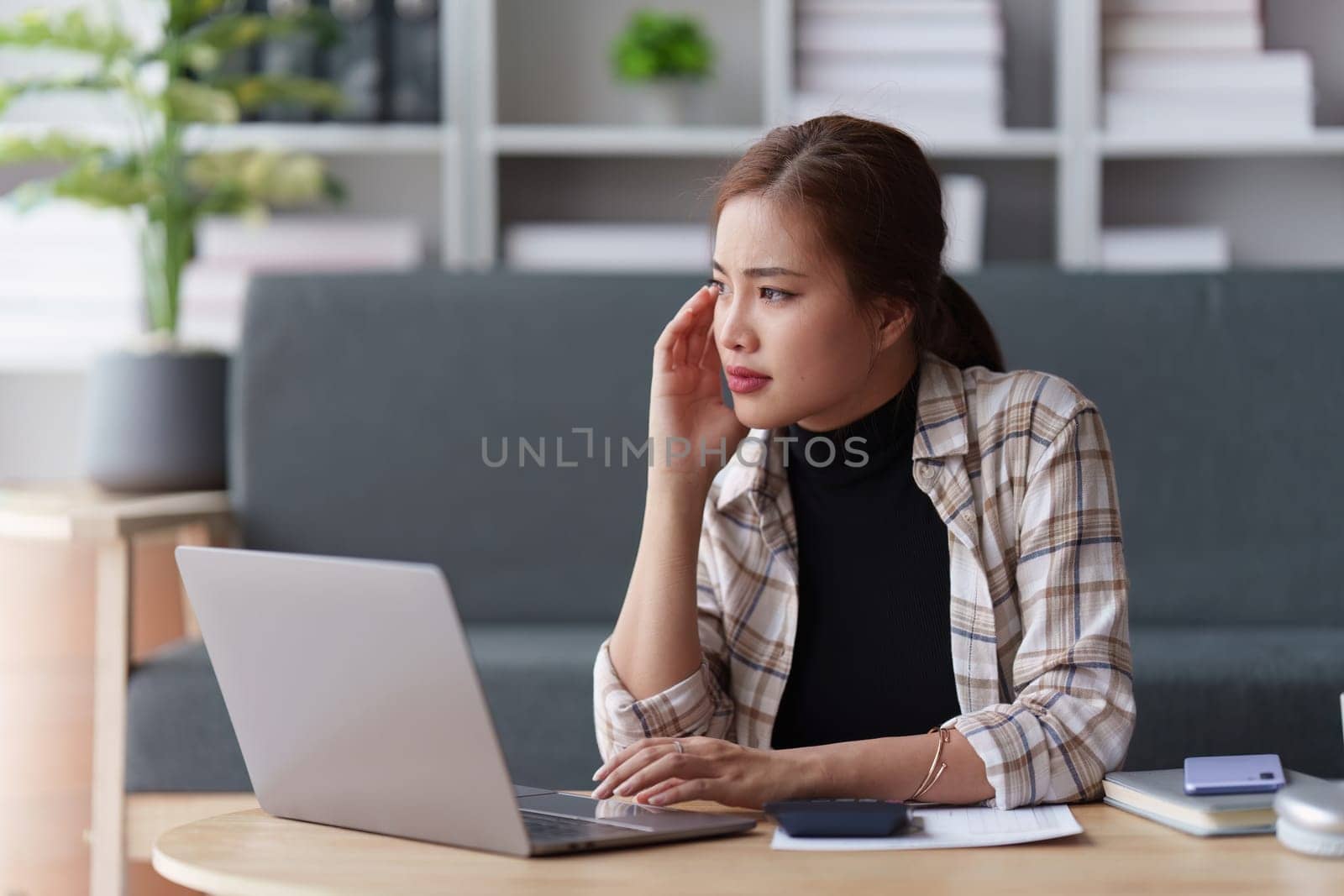 Deadline with young business woman feeling stressed concept. Business woman working at office, business finance concept.