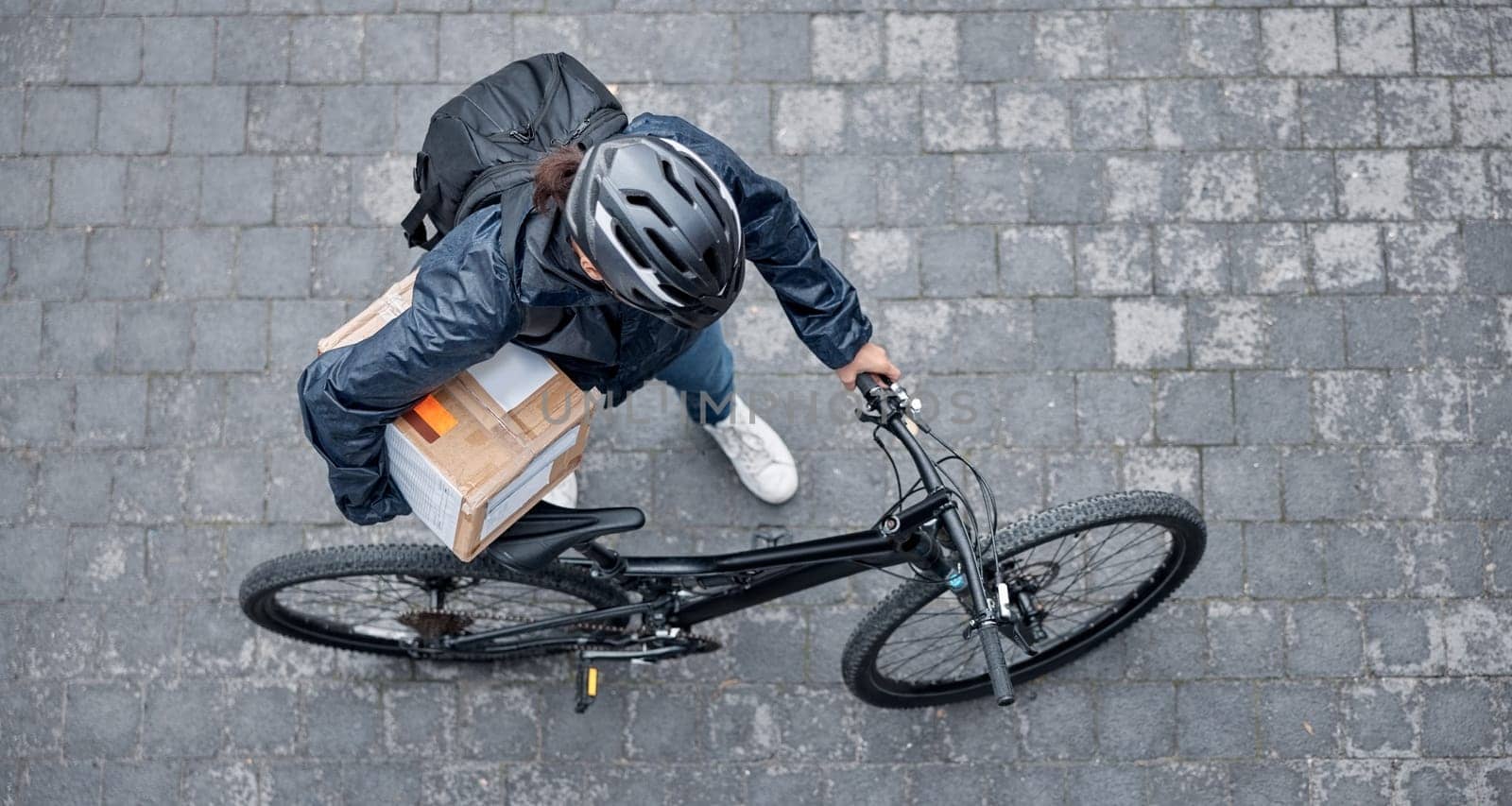 Delivery, package and man with a bicycle and box in the street for consumer order in the city. Transport, courier and male bike driver with stock with eco friendly transportation in the road in town. by YuriArcurs