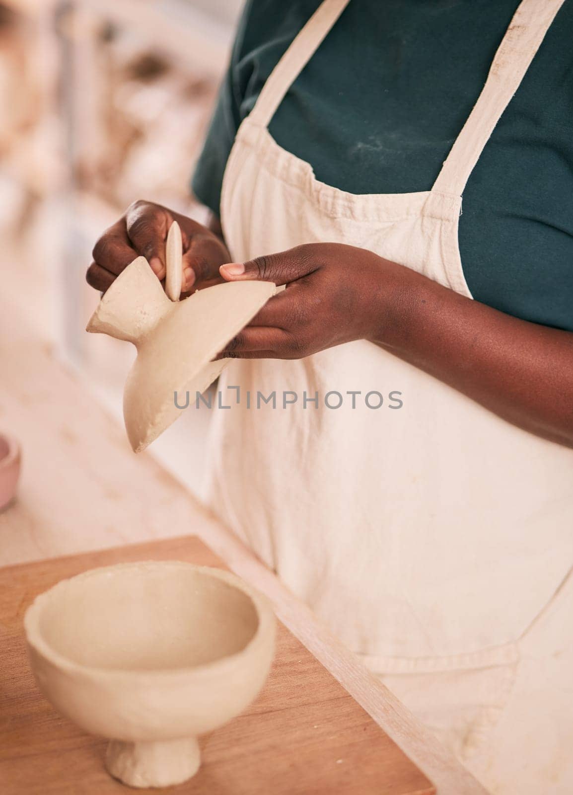 Art, pottery and black woman hands in creative workshop with ceramics, sculpting and creativity with clay pot zoom. Artist, handmade craft and manufacturing, artistic process with texture and skill by YuriArcurs