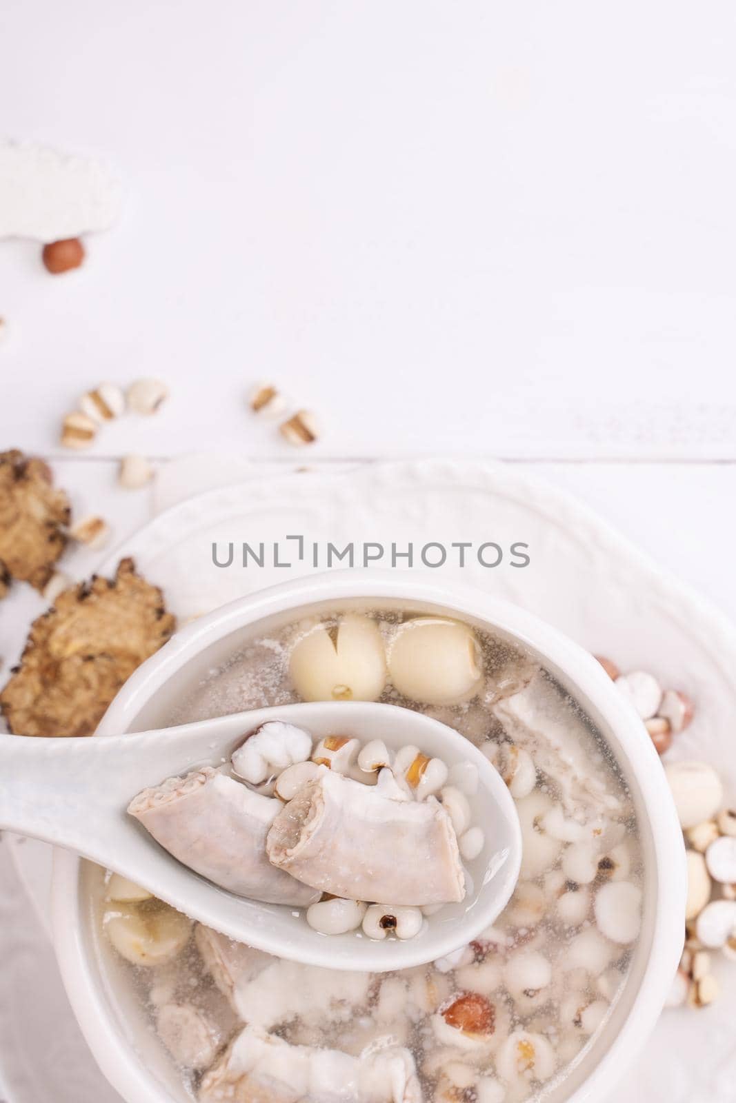 Tasty Four Tonics Herb Flavor Soup,Taiwanese traditional food with herbs,pork intestines on white wooden table,close up,flat lay,top view