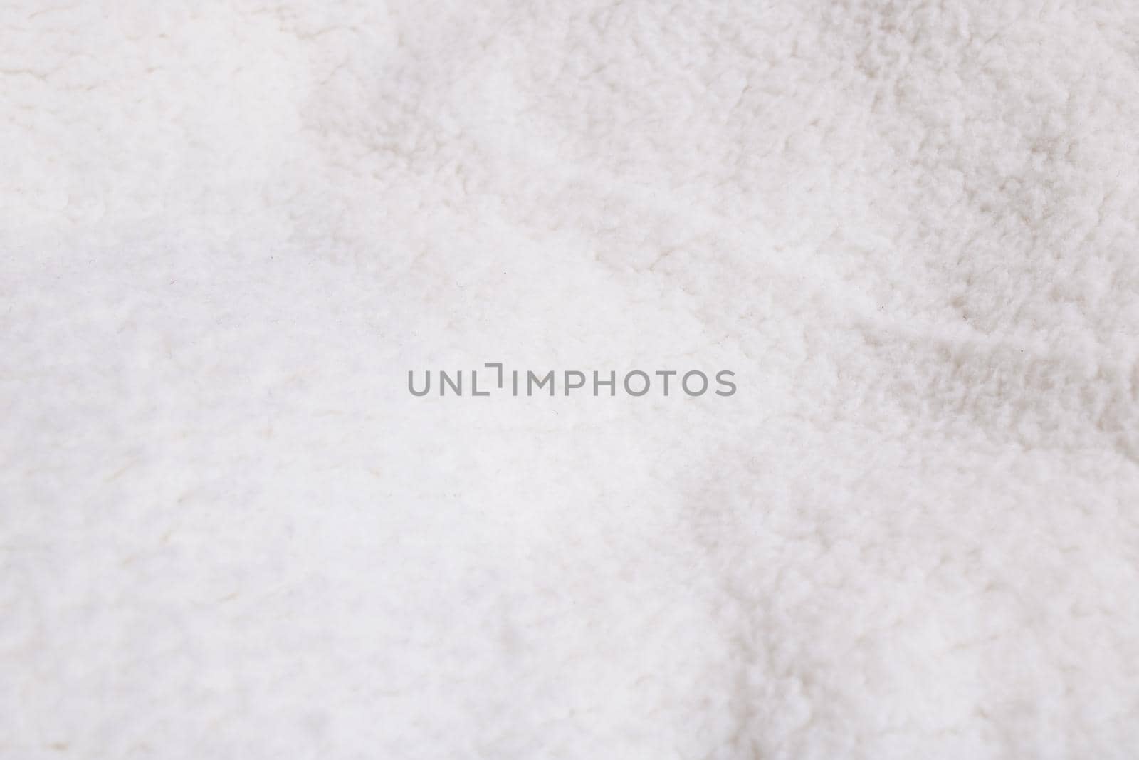Texture of white woolen clothes close up, background