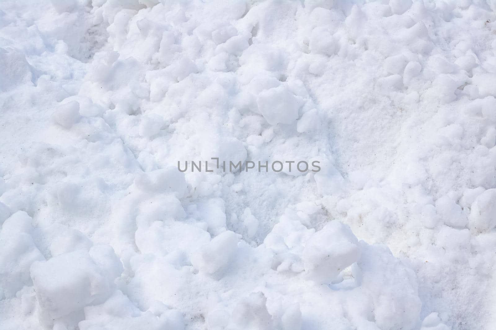 Clods of white snow close up, background or texture
