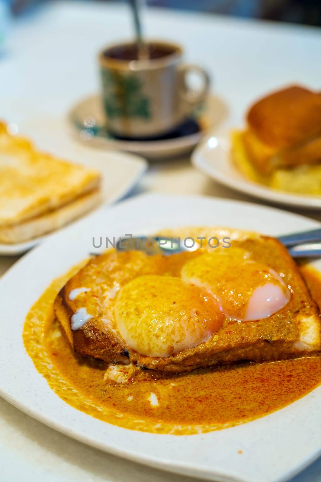 Eggs, toast with Kaya and Butter and coffee in Kuala Lumpur by f11photo