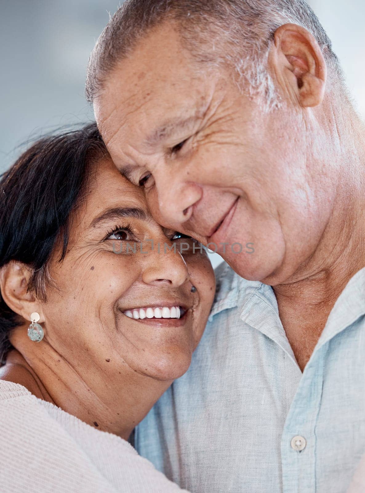Senior couple, hug and smile of love, care and romance at home. Happy man, woman and face of retirement people embrace for happiness, support and relax in marriage together, house or trust of partner.