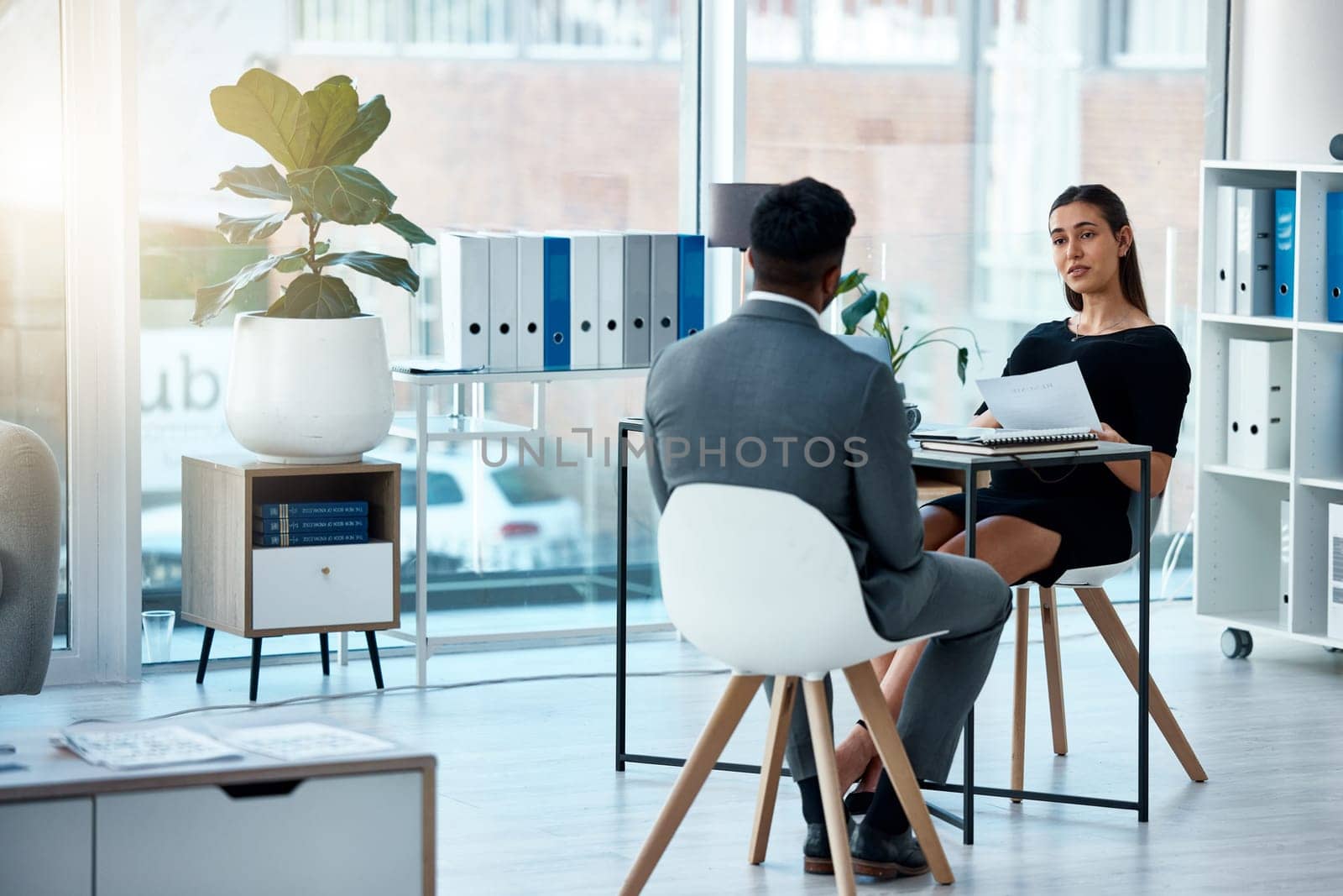 Business meeting, hiring and cv of a corporate woman with hr and communication in office. Paperwork, interview and outsourcing in a company with professional opportunity in the workplace with offer by YuriArcurs