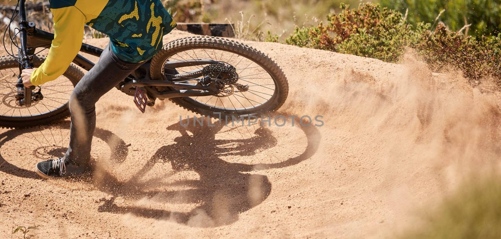 Dirt bike, dust and rider for sports workout in the mountain for fitness and active lifestyle. Bicycle, cyclist and cycling sportsman for fun adrenaline activity while biking in nature for adventure by YuriArcurs