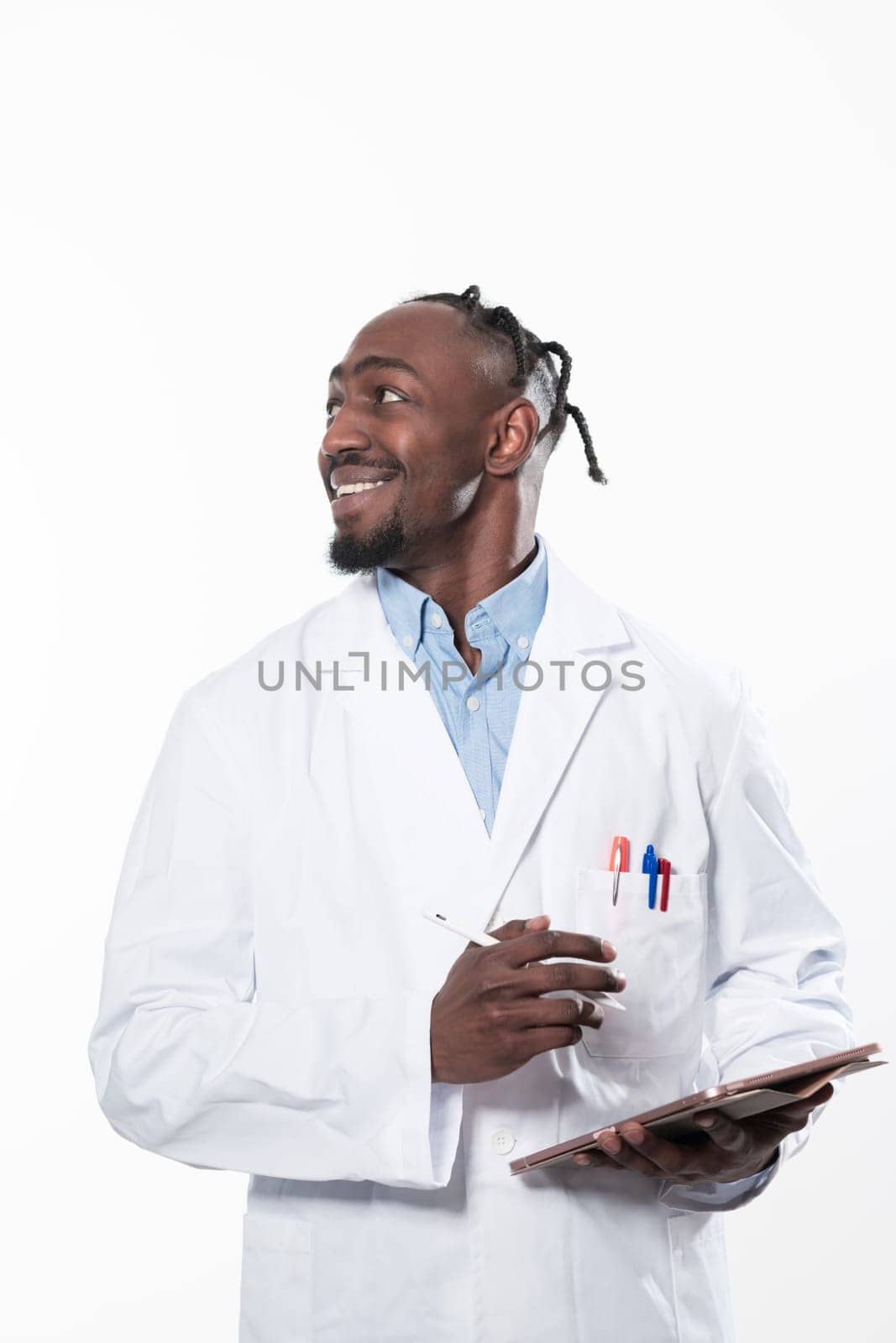 Doctor dark skin guy virologist agent corona virus seminar conference arms crossed pandemic virus expert wear white lab coat isolated white color background using a tablet computer. High quality photo