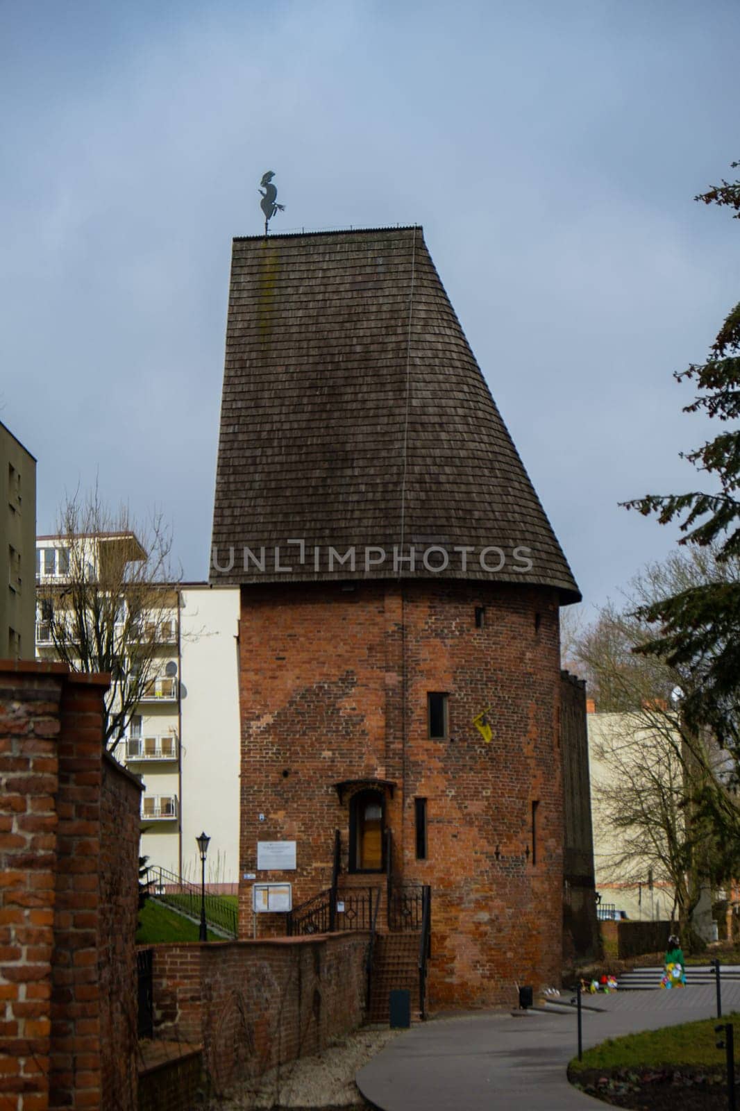 Round tower in the historic surrounding city wall of Slupsk, Poland. Witches tower - Baszta Czarownic in Slupsk. Sights of Poland. Old jail. Travel destination. Tourist attraction