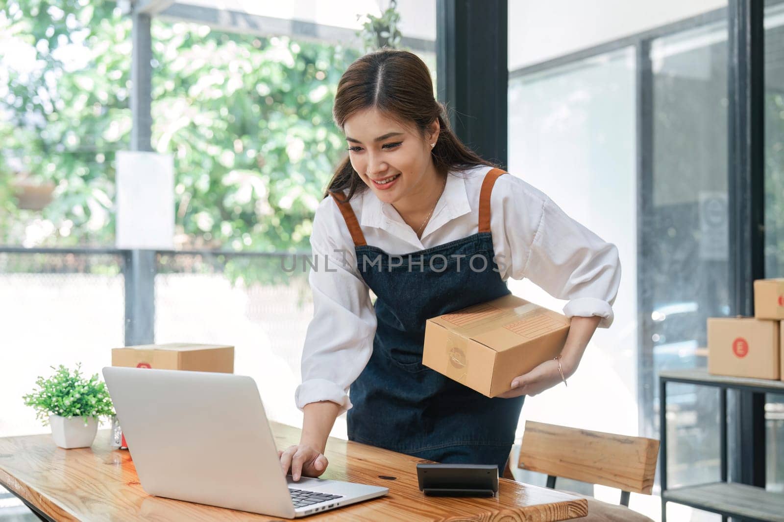 Business From Home Asian woman preparing package delivery box Shipping for shopping online. young start up small business owner at home online order.