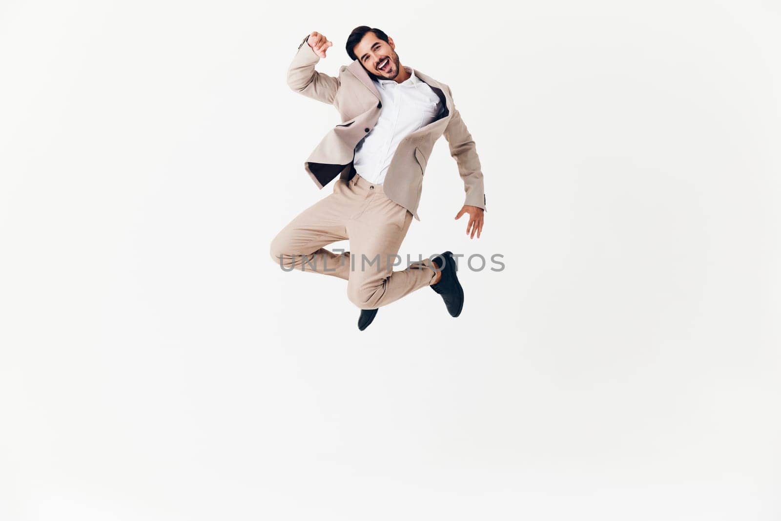 white man standing victory suit happy idea flying young smiling adult attractive winner job occupation copyspace beige business running businessman eyeglass