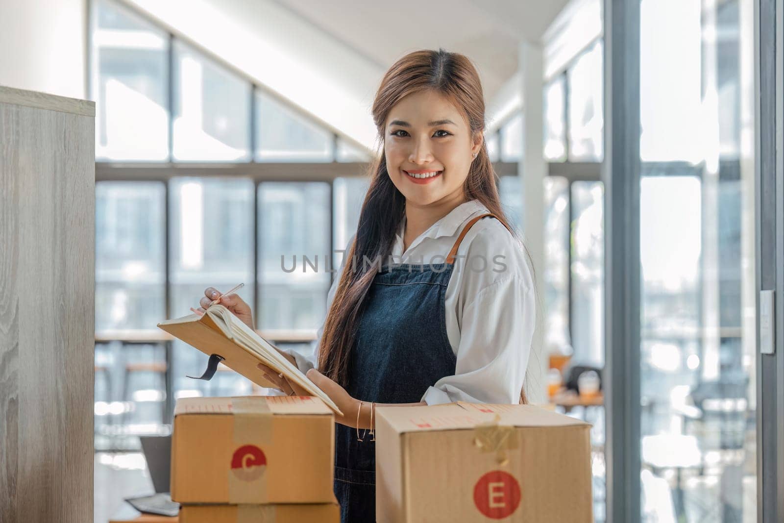 Business From Home Asian woman preparing package delivery box Shipping for shopping online. young start up small business owner at home online order.