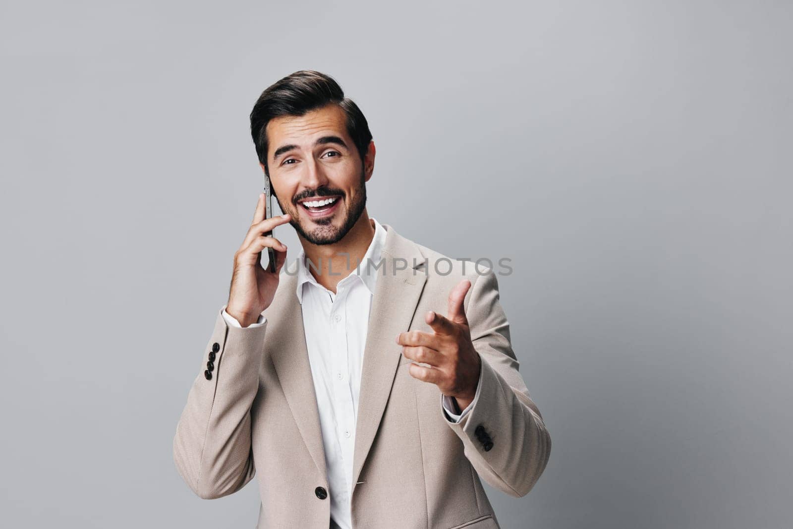 man portrait happy guy business phone hold suit smartphone call smile by SHOTPRIME
