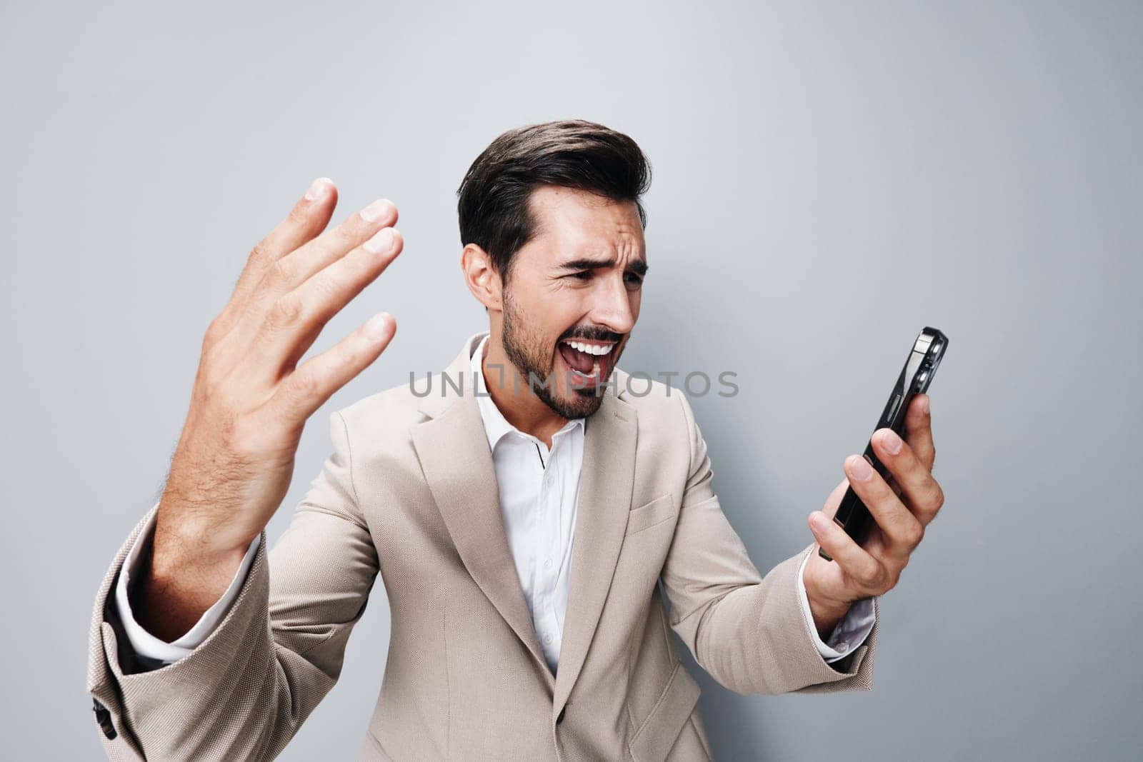 business man call smartphone hold suit smile happy phone beard portrait by SHOTPRIME