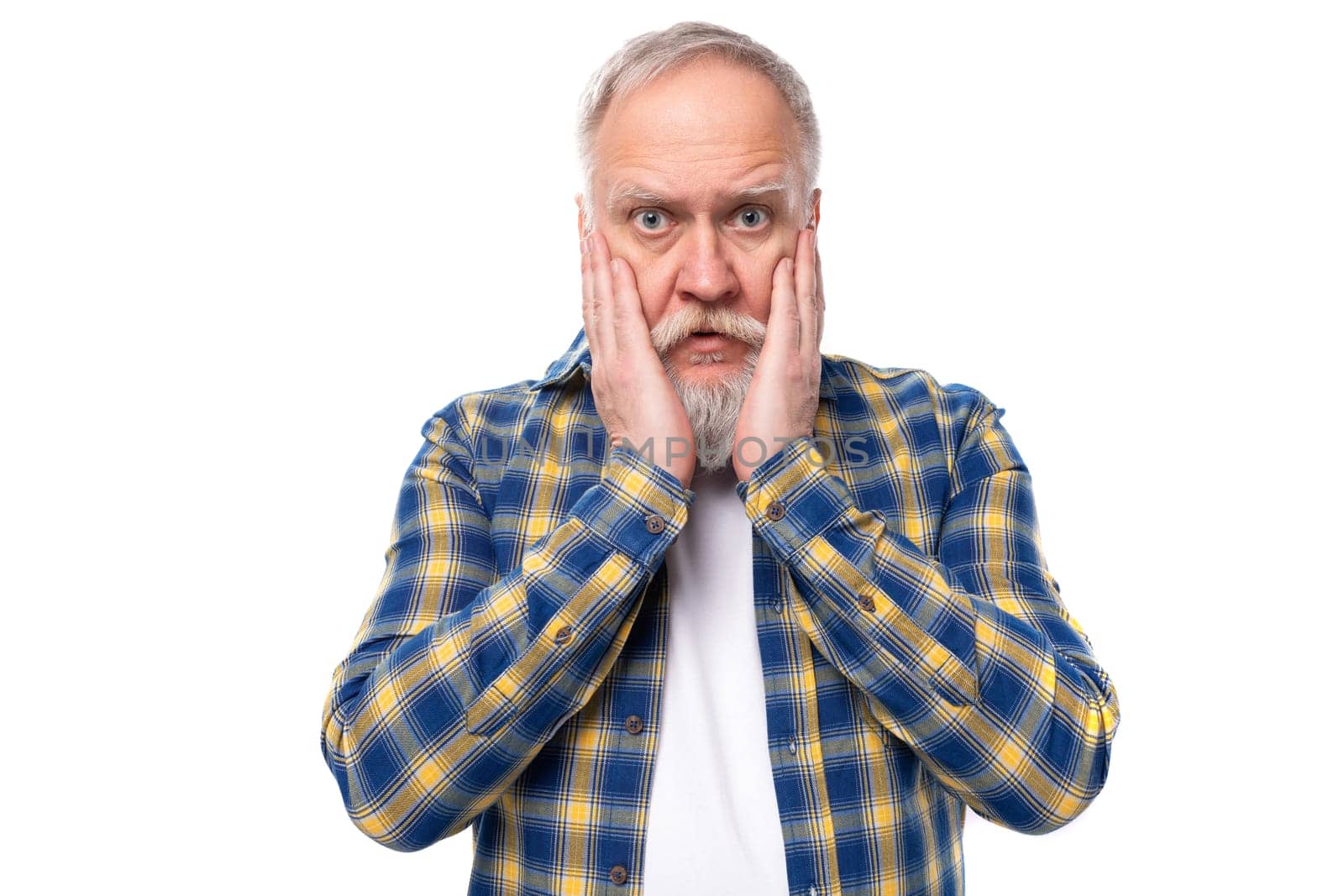 handsome 50s elderly gray-haired man with a beard is going through thinking on a white background by TRMK