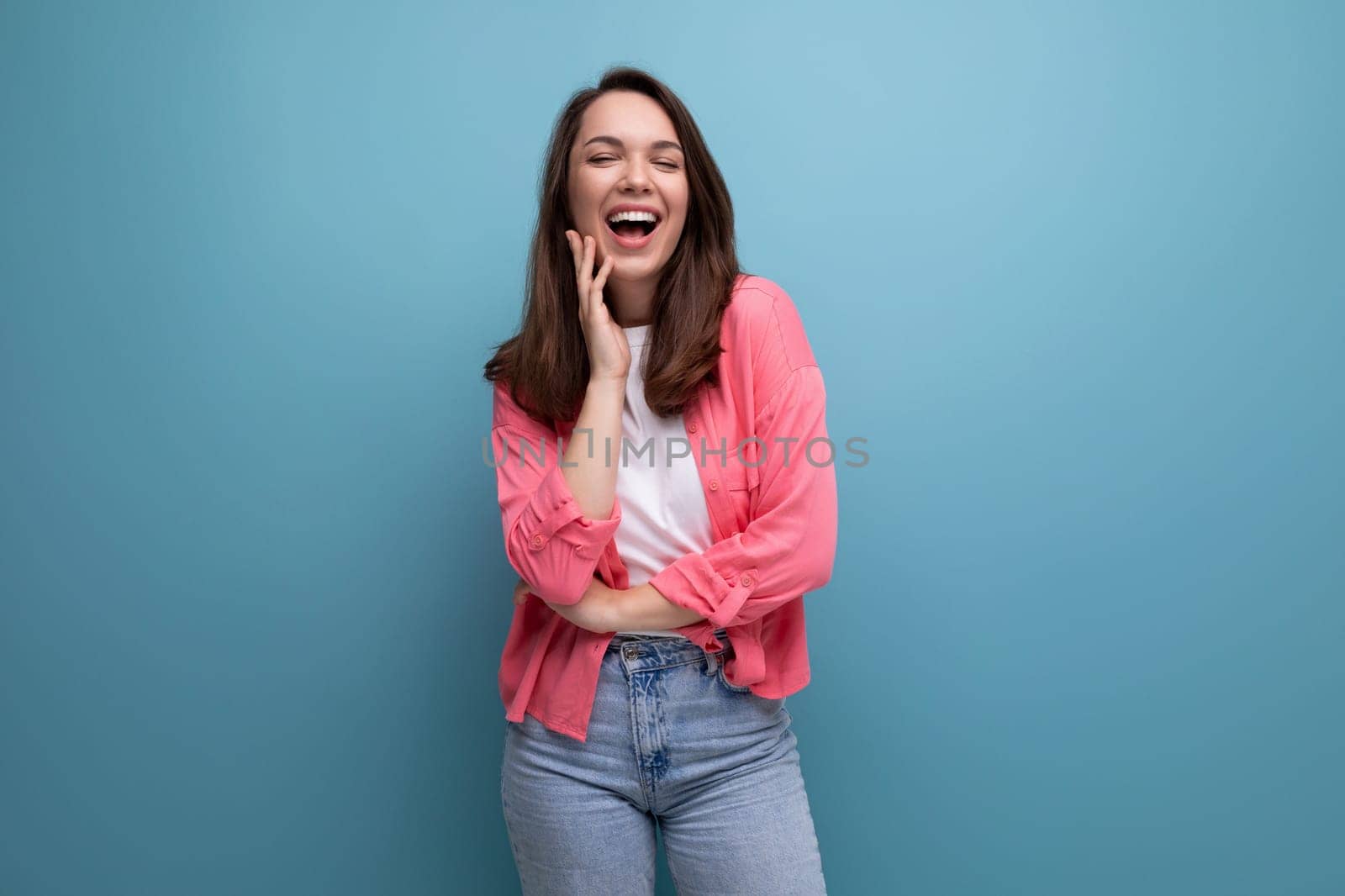 incredibly smiling happy young lady in a stylish summer look on a studio isolated background by TRMK