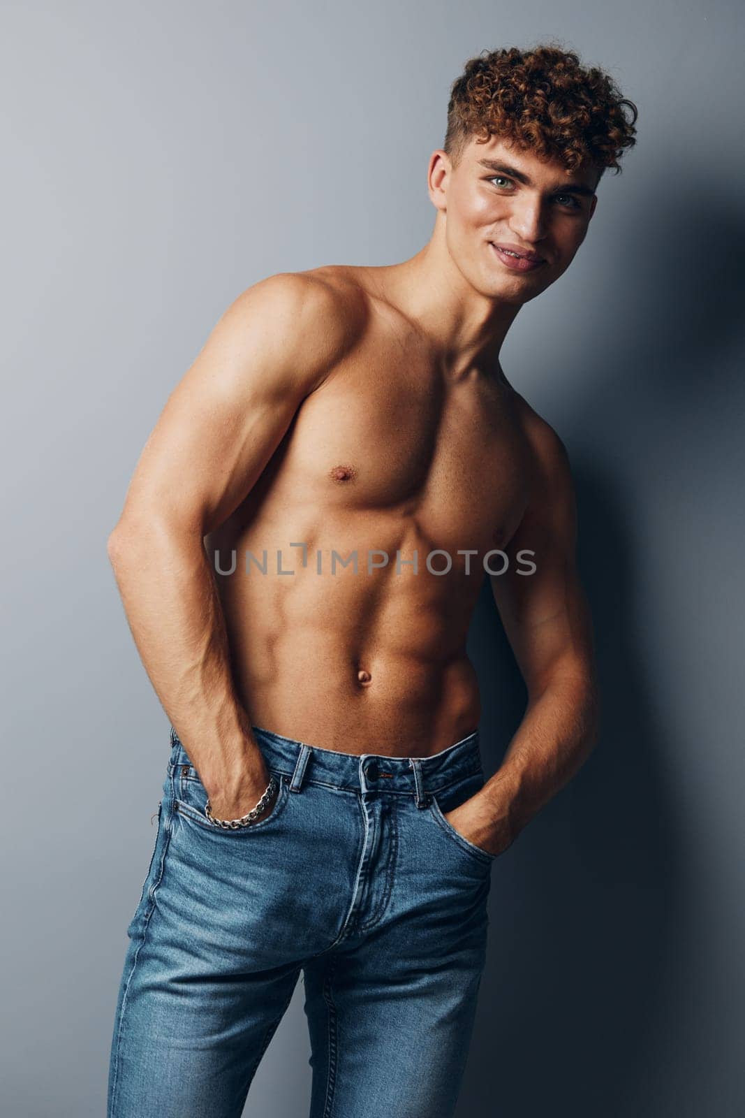 man beauty male studio sexy jeans standing guy fashion sport muscular bodybuilder health chest fitness muscle background torso