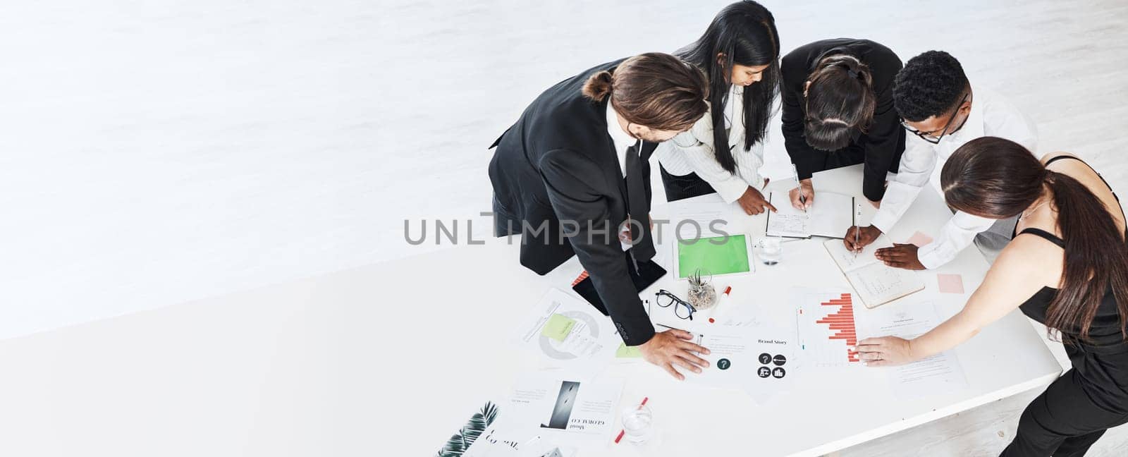 Meeting, finance and planning with a business team working around a table in the boardroom from above. Accounting, documents and teamwork with a man and woman employee group at work in an office by YuriArcurs