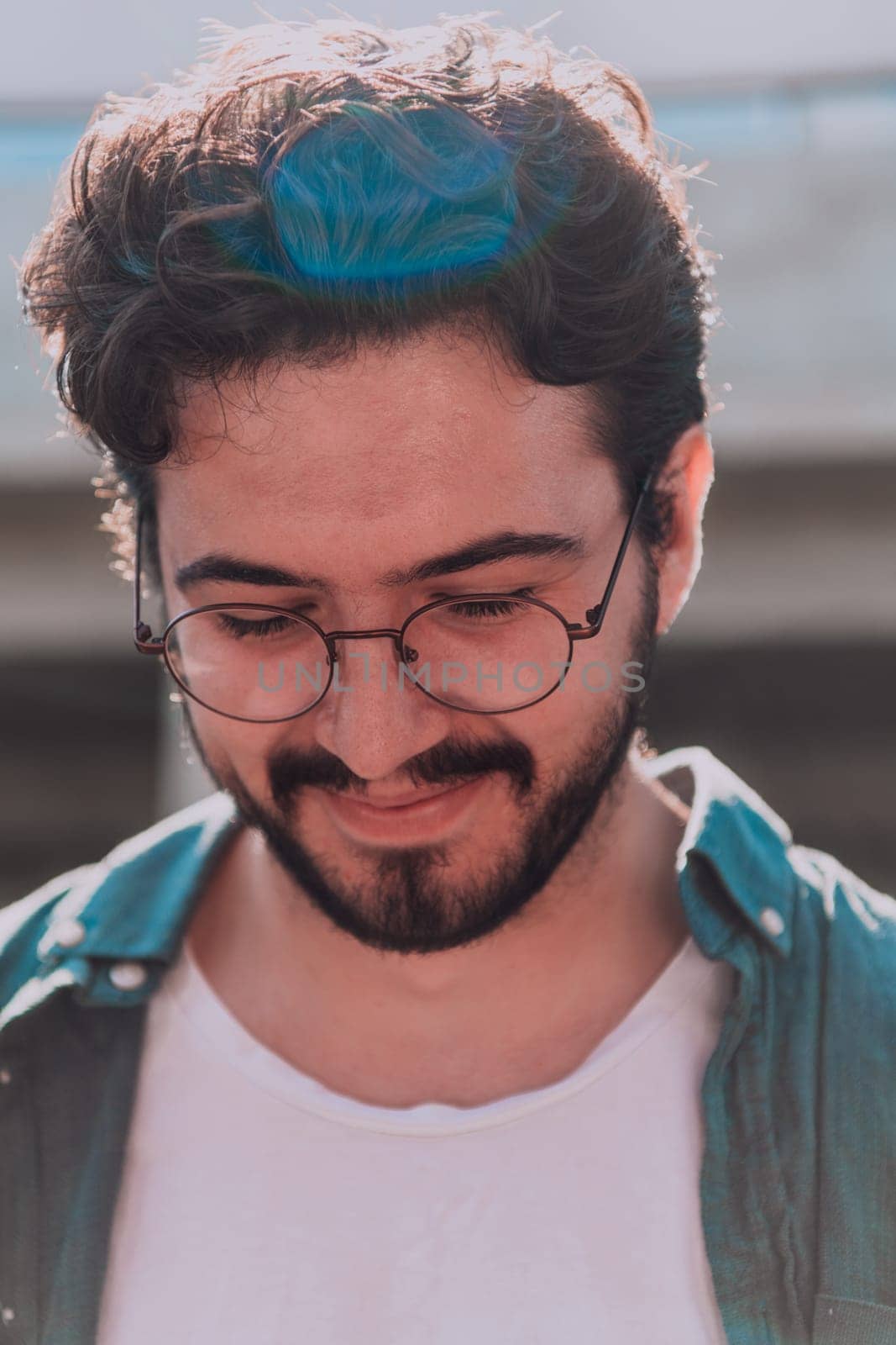 A portrait of a modern man, exuding confidence and style, against an outdoor backdrop, showcasing his charisma and fashionable demeanor. by dotshock