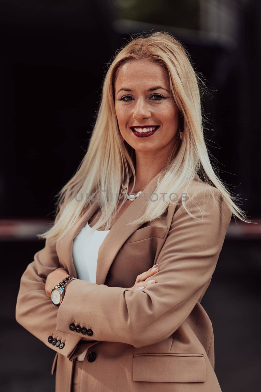 A powerful portrait of a businesswoman, standing confidently with her arms crossed, representing the determination of the female gender and embodying strength and success by dotshock