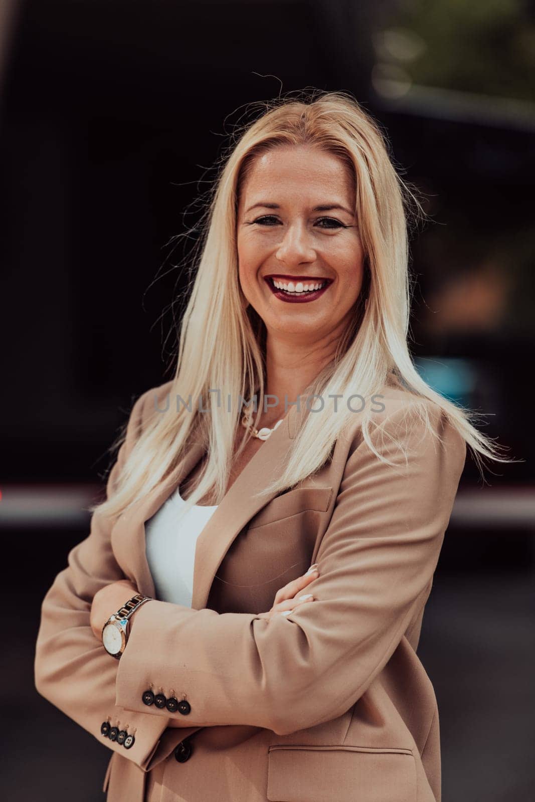 A powerful portrait of a businesswoman, standing confidently with her arms crossed, representing the determination of the female gender and embodying strength and success by dotshock