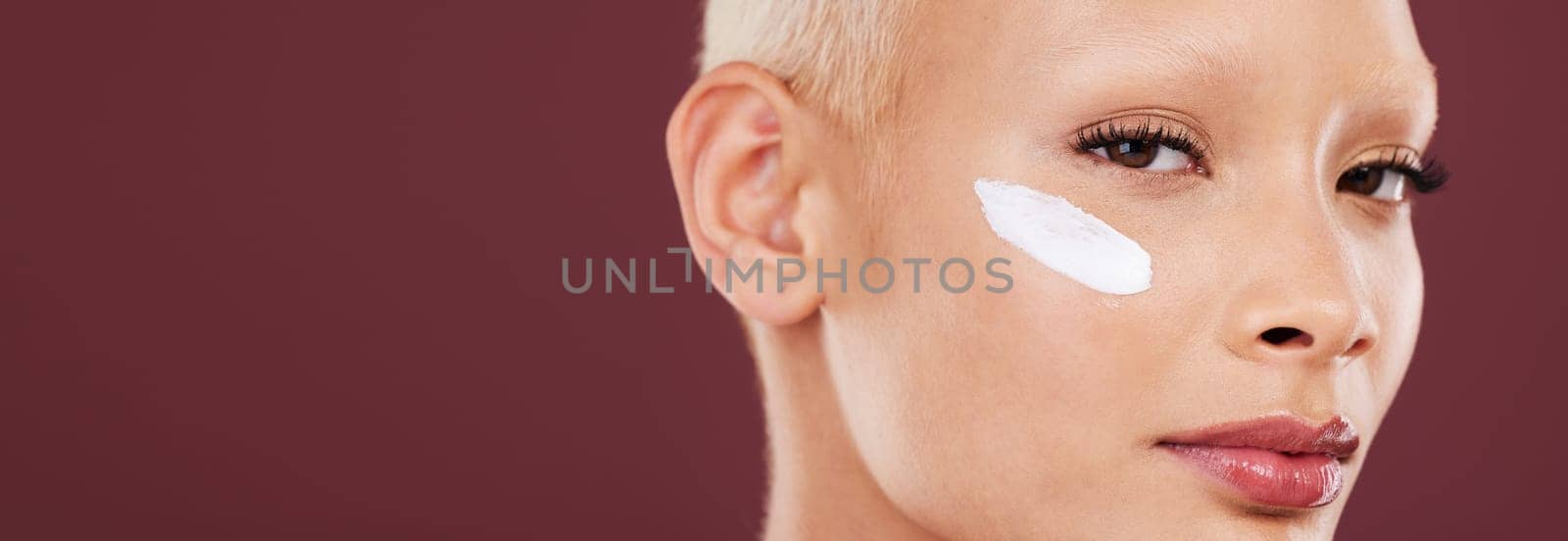 Skincare, beauty and portrait of woman with cream on face, cosmetics and skin product on studio background. Dermatology, spa facial treatment and model isolated with mockup, anti ageing care and glow.