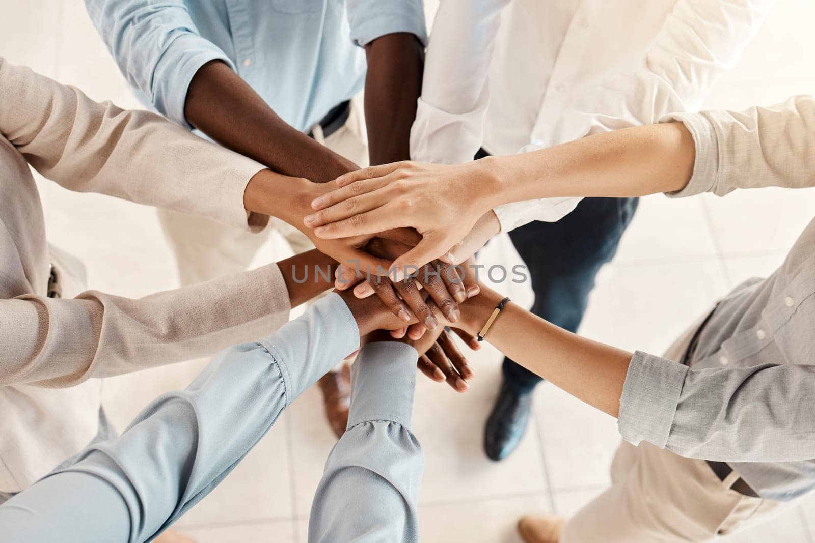 Hands, team with support and solidarity, diversity with business people, collaboration and trust in the workplace. Community, team building and working together, office teamwork and partnership. by YuriArcurs
