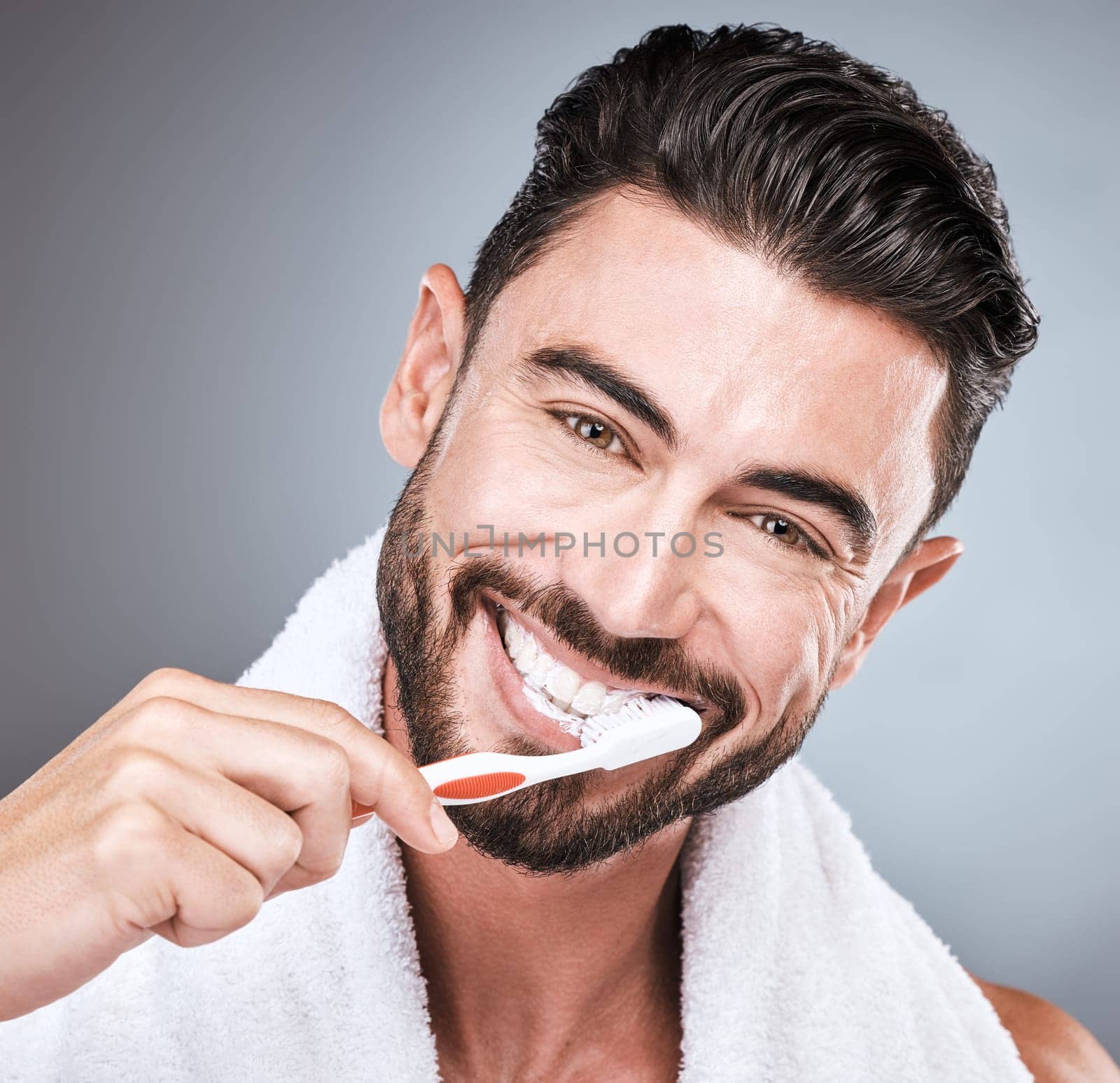 Brushing teeth, studio portrait and man with toothbrush, dental wellness and healthy mouth care. Happy face, male model and oral cleaning for fresh breath, smile and facial happiness with toothpaste.
