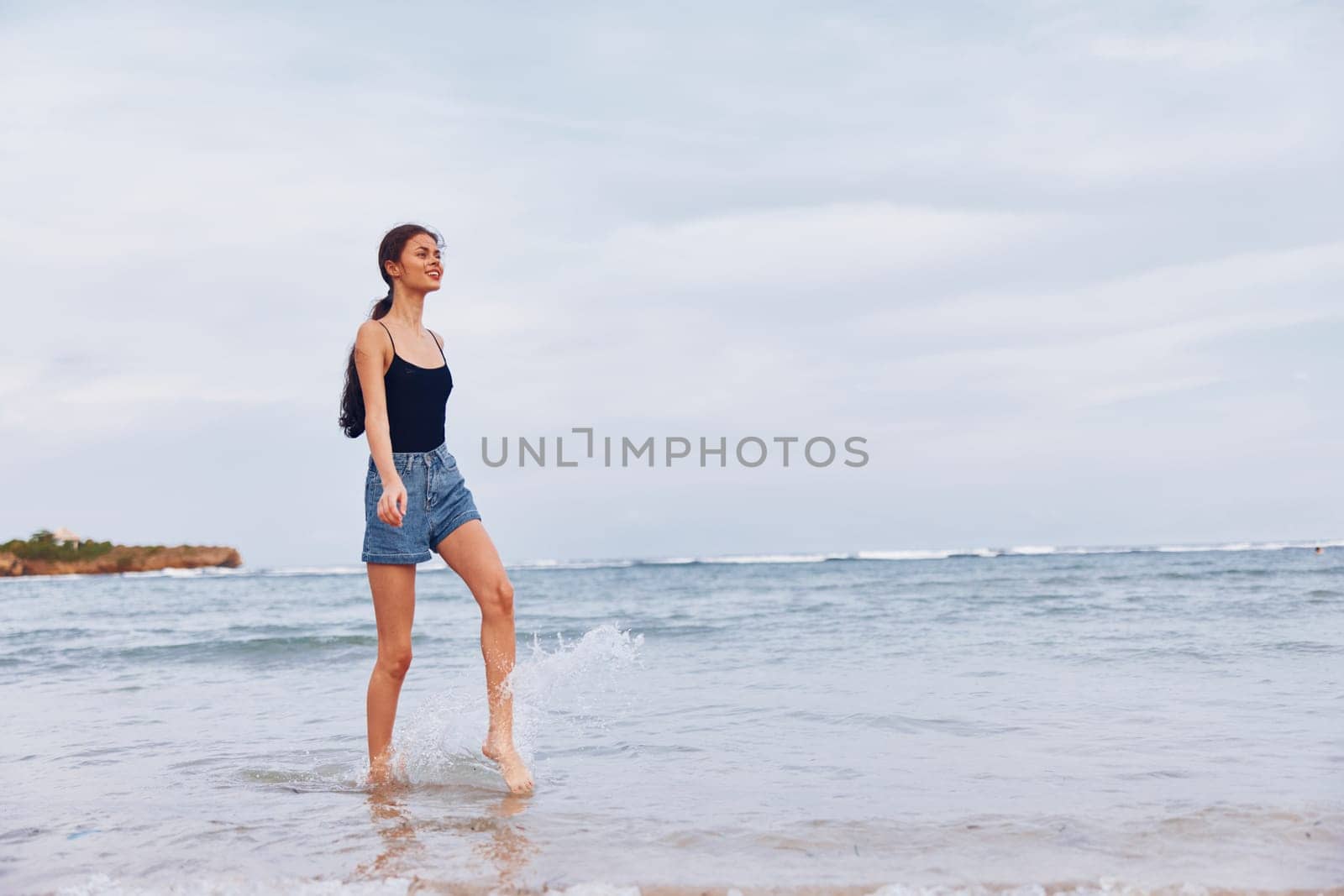 flight woman young lifestyle walking sand tan travel beach leisure sunset water happiness summer smile running space carefree copy beauty sea hair