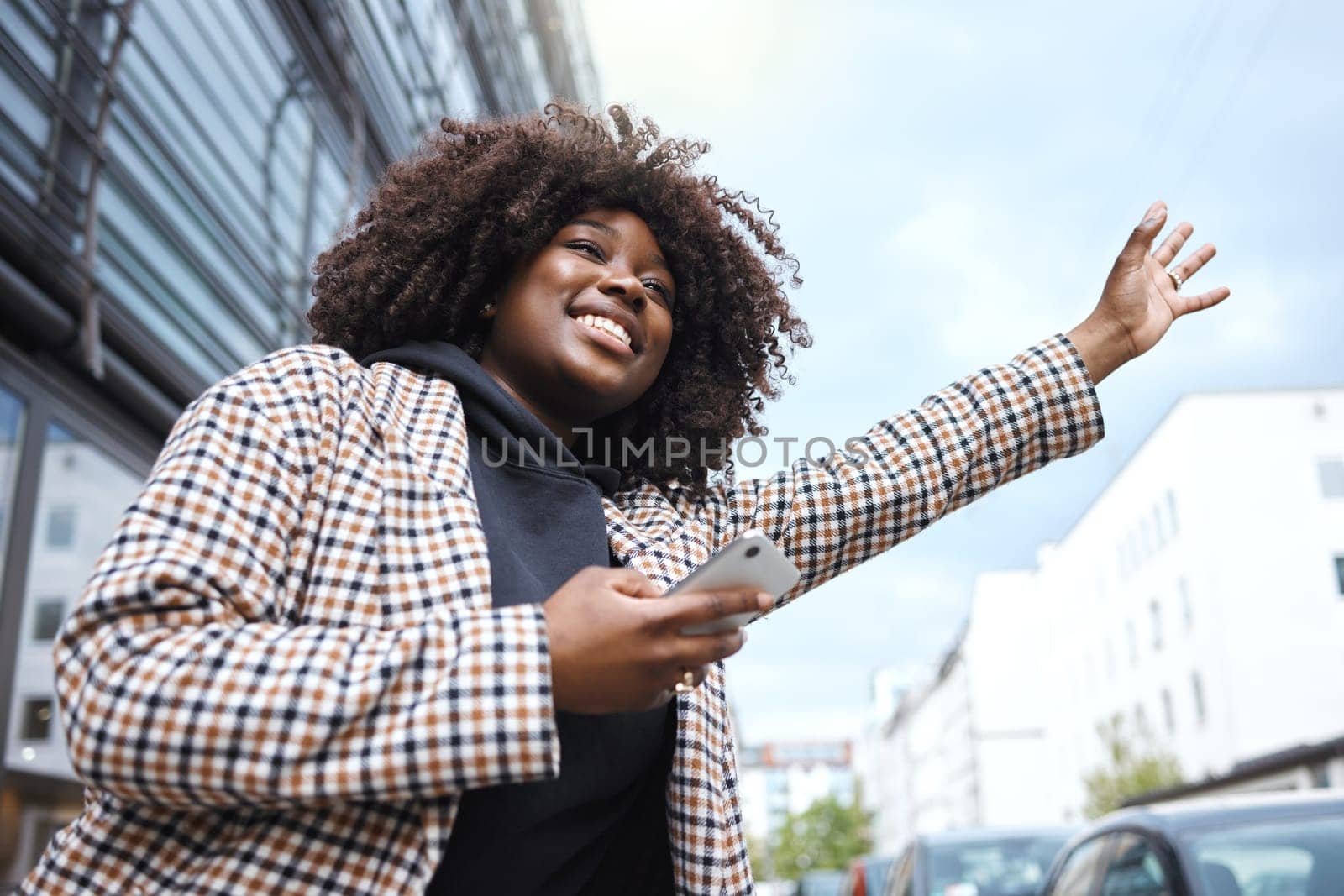 Taxi, sign and hands of black woman in city for travel, commute or waiting for transport on blue sky background. Hand, bus and stop by girl in Florida for transportation service, app or drive request by YuriArcurs