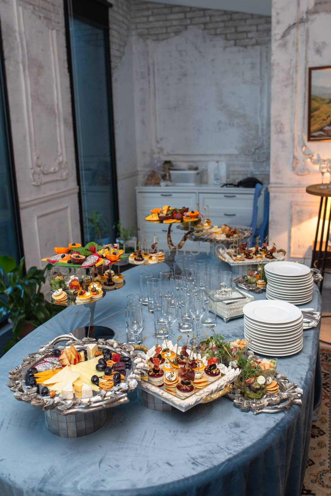 close-up of assorted canapes on the buffet table by Pukhovskiy