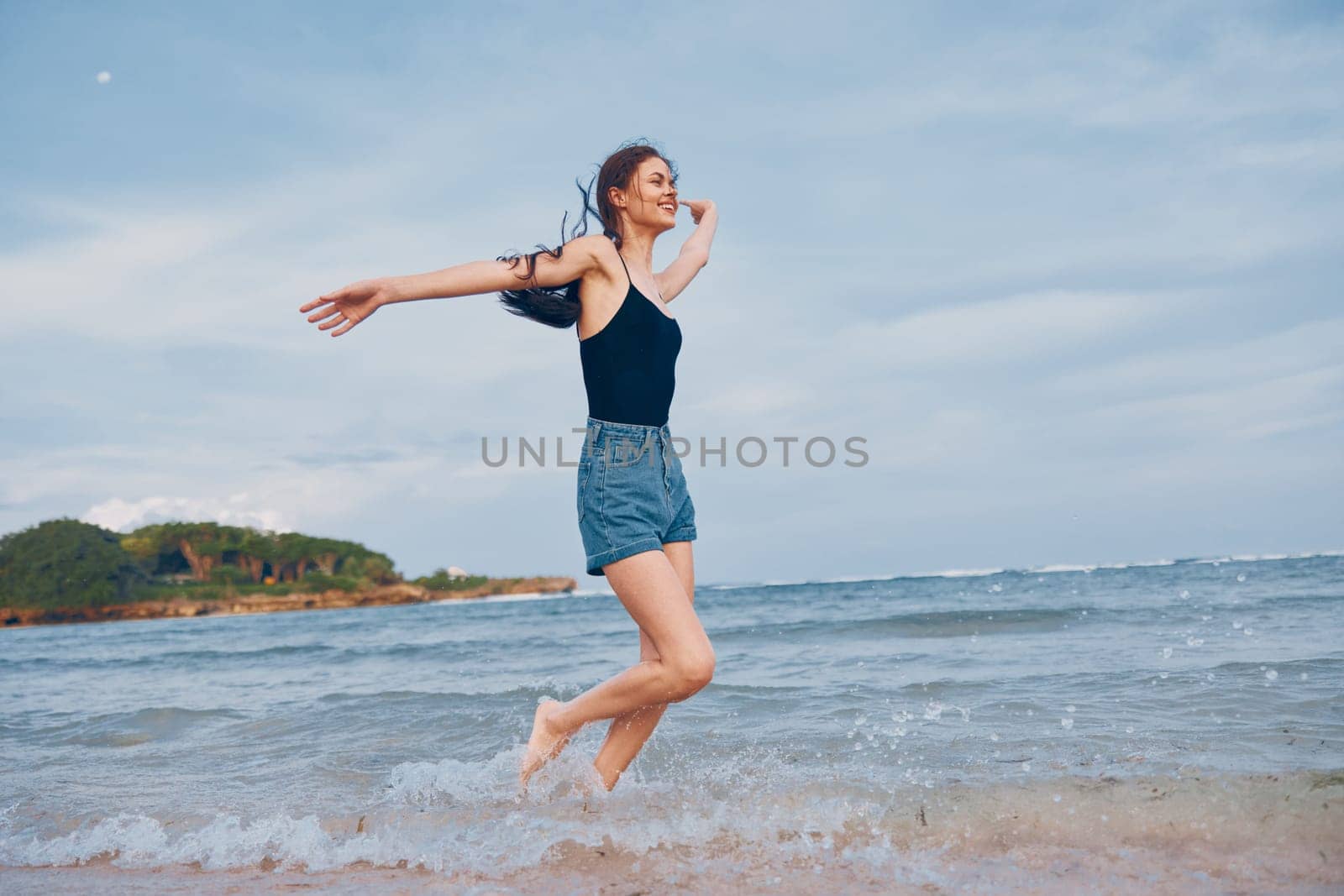 woman walking sea summer shore lifestyle sun sunset beautiful happiness hair carefree body beach sexy smile travel young long smiling running happy