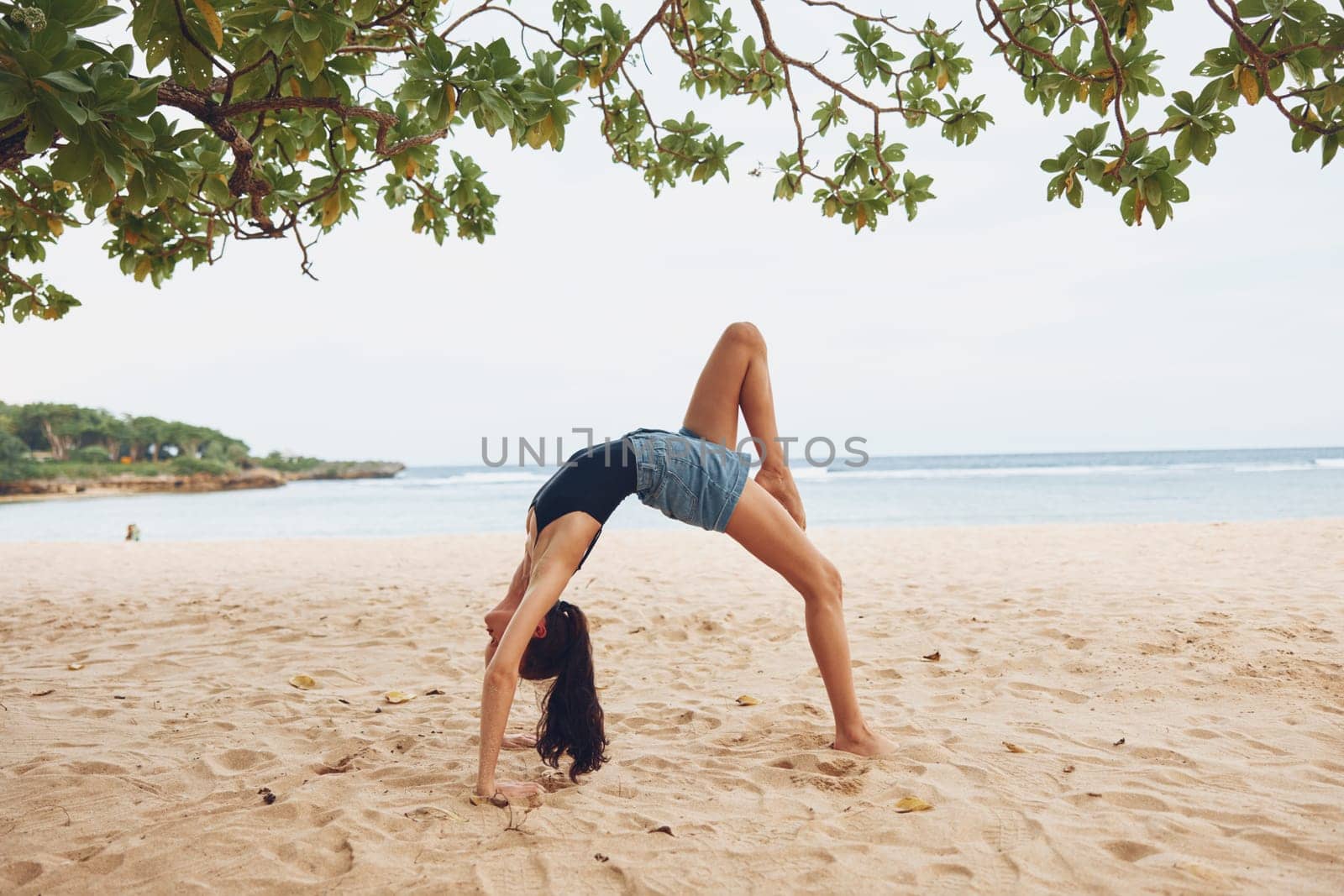 woman summer fitness exercise practice bend training person balance stretching lifestyle gymnastics active yoga bridge female beach relax ocean young sport