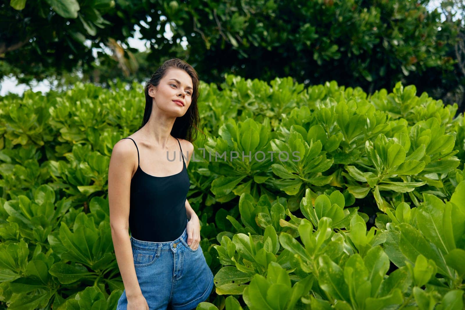 beautiful woman summer hat park nature sunset lifestyle walk outdoor quiet smiling freedom joy young meditation female t-shirt meadow relax day