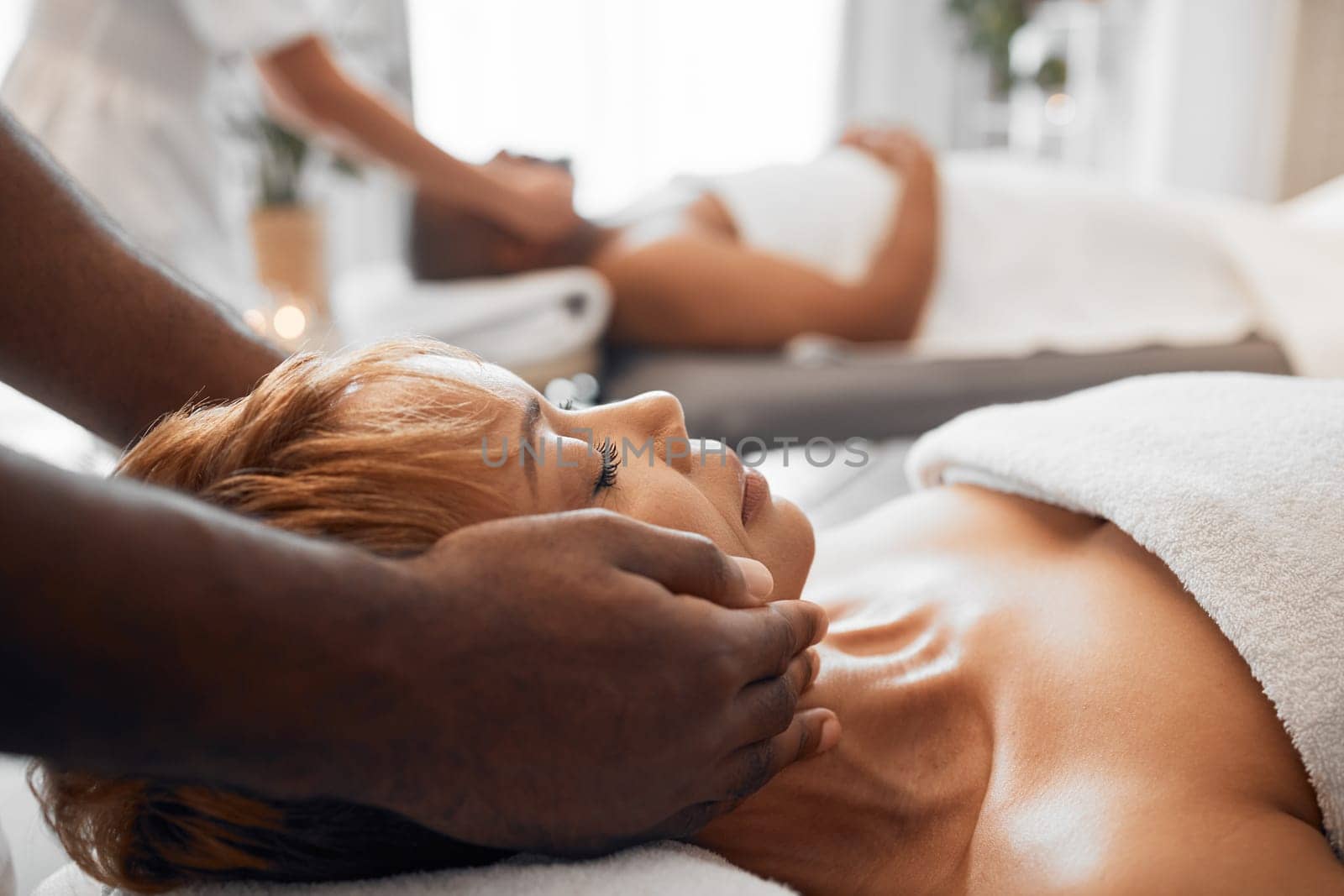 Spa, wellness and black woman getting massage with massage therapist hands and relax with stress relief. Beauty treatment salon, body therapy and relaxation, peace and calm with luxury service