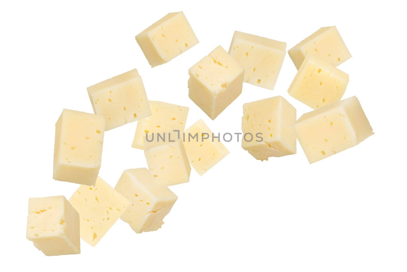 Lots of cheese pieces isolated on a white background. Cheese for pizza. A lot of pieces of cheese fall on the isolate, cut into squares on a white background, close-up. Insert into design or project. by SERSOL