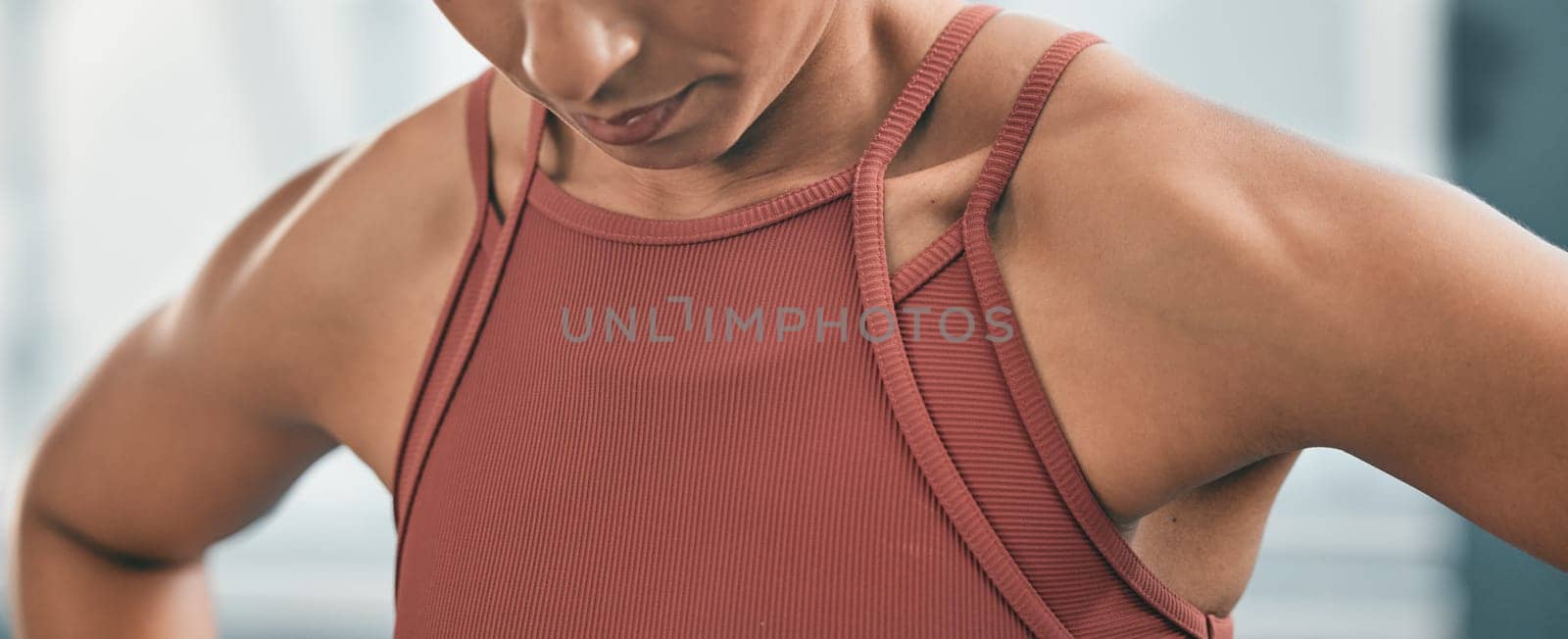 Fitness, tired and breathing with the shoulders of a black woman in the gym after a workout for health. Exercise, exhausted and breath with an athlete training for wellness or a healthy lifestyle by YuriArcurs