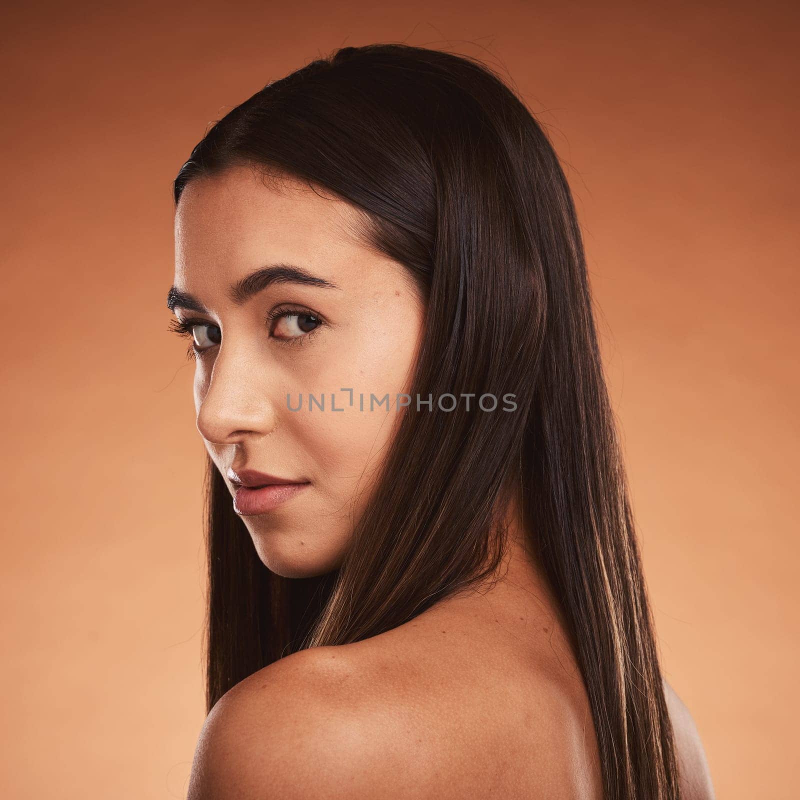 Makeup, skincare and young woman with natural beauty, cosmetics and pride with brown studio background. Portrait, female and girl face for wellness, healthy or organic facial for smooth skin and glow.