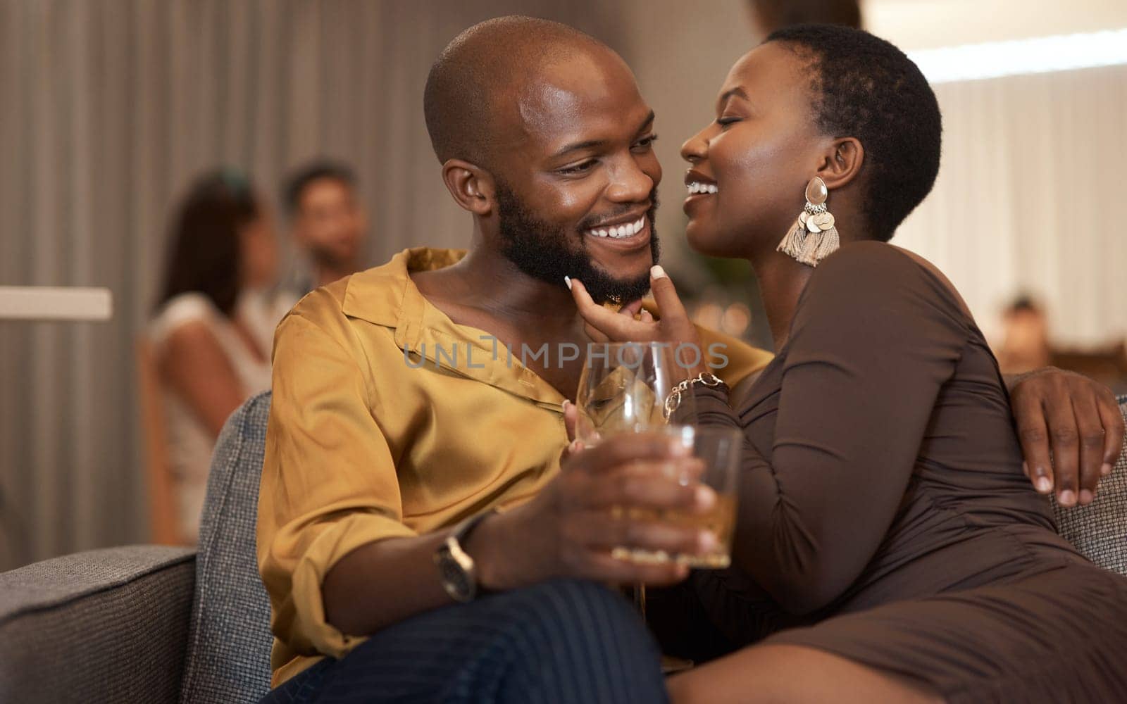 Love, event or couple of friends at a party in celebration of new years drinking wine or whiskey on holiday. Romance, black woman and black man talking, embrace or bonding on a relaxing romantic date.