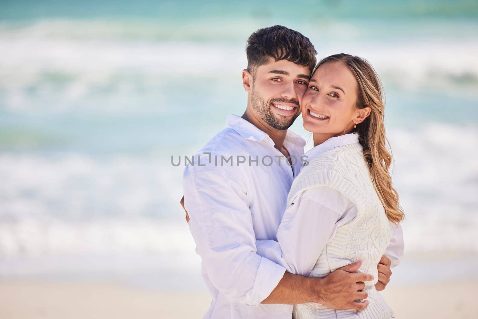 Portrait, love or couple hug at beach on holiday vacation or romantic honeymoon to celebrate marriage commitment. Travel, trust or woman bonding or hugging a happy partner in fun summer romance.