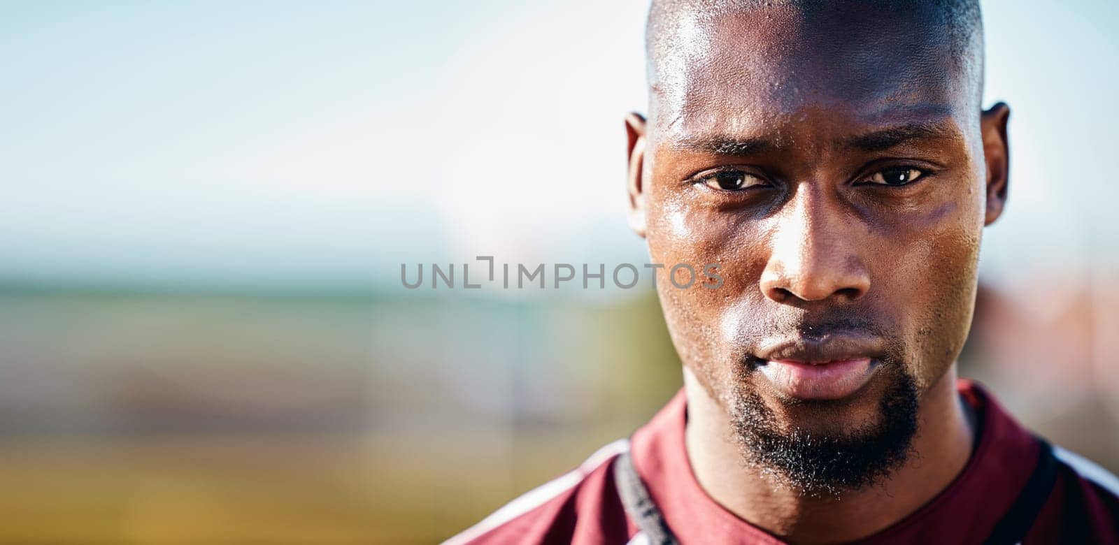Black man, athlete and face with focus, sport and fitness outdoor with mockup space, sweat and determined. Portrait, exercise and sports with training, mindset and motivation with workout in Jamaica.