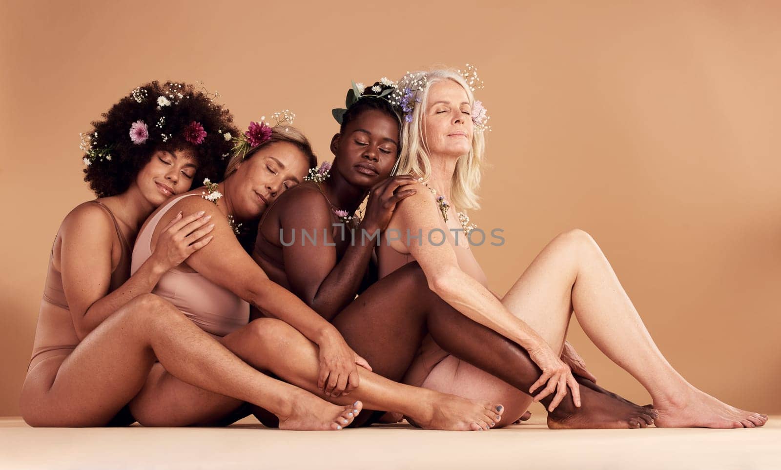 Diversity, women and hug of underwear model group of friends with peace from eco friendly skincare. Body positivity, happy and woman feeling calm, happiness and beauty from skin and flower hair care.